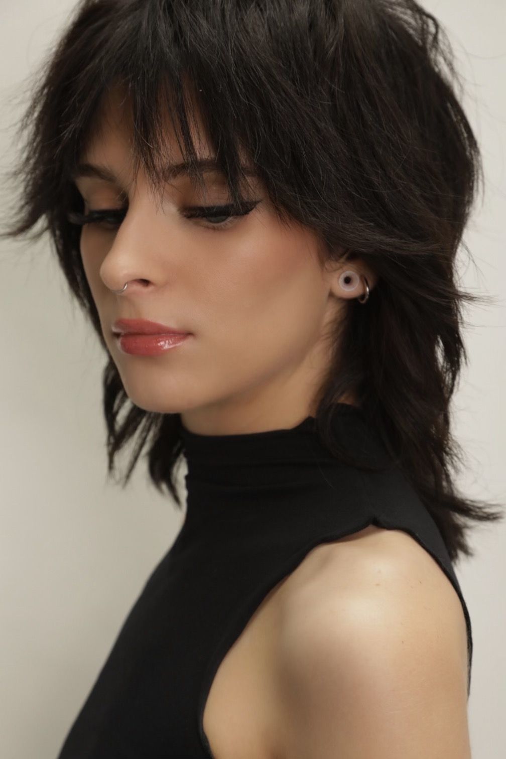 model sporting a variation of a shaggy wolf cut