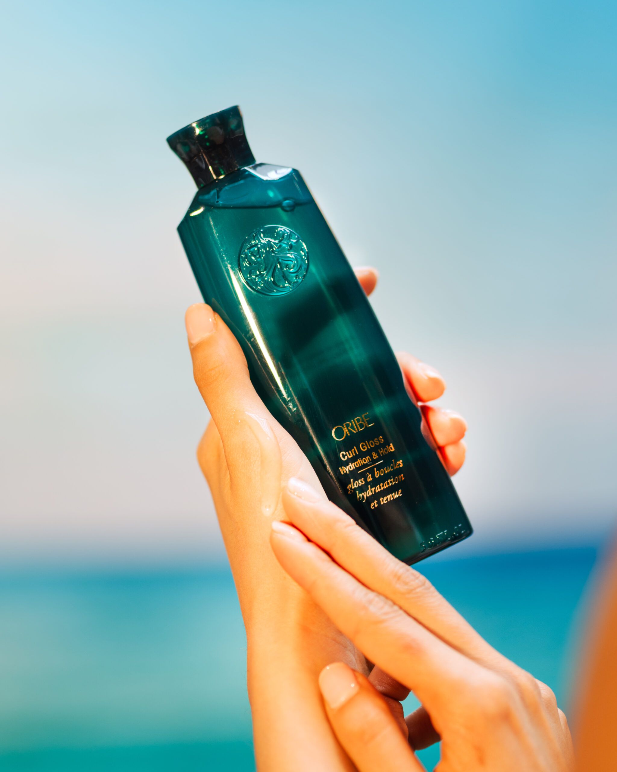 Oribe Curl Gloss lightweight styling gel ideal for low porosity curly hair with water-based, hydrating ingredients