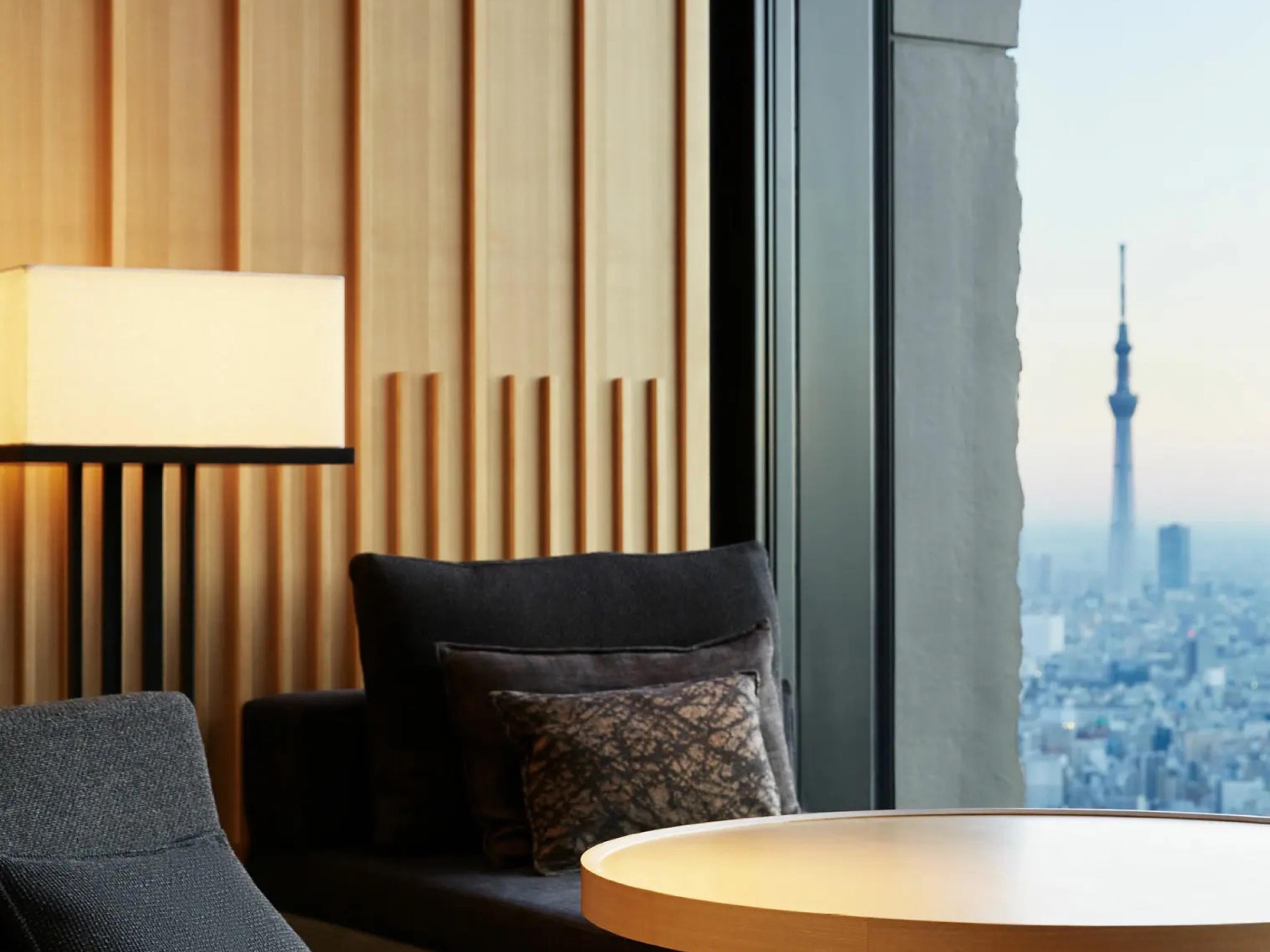 A window seat high above Tokyo, with the Skytree rising out of the haze over the city