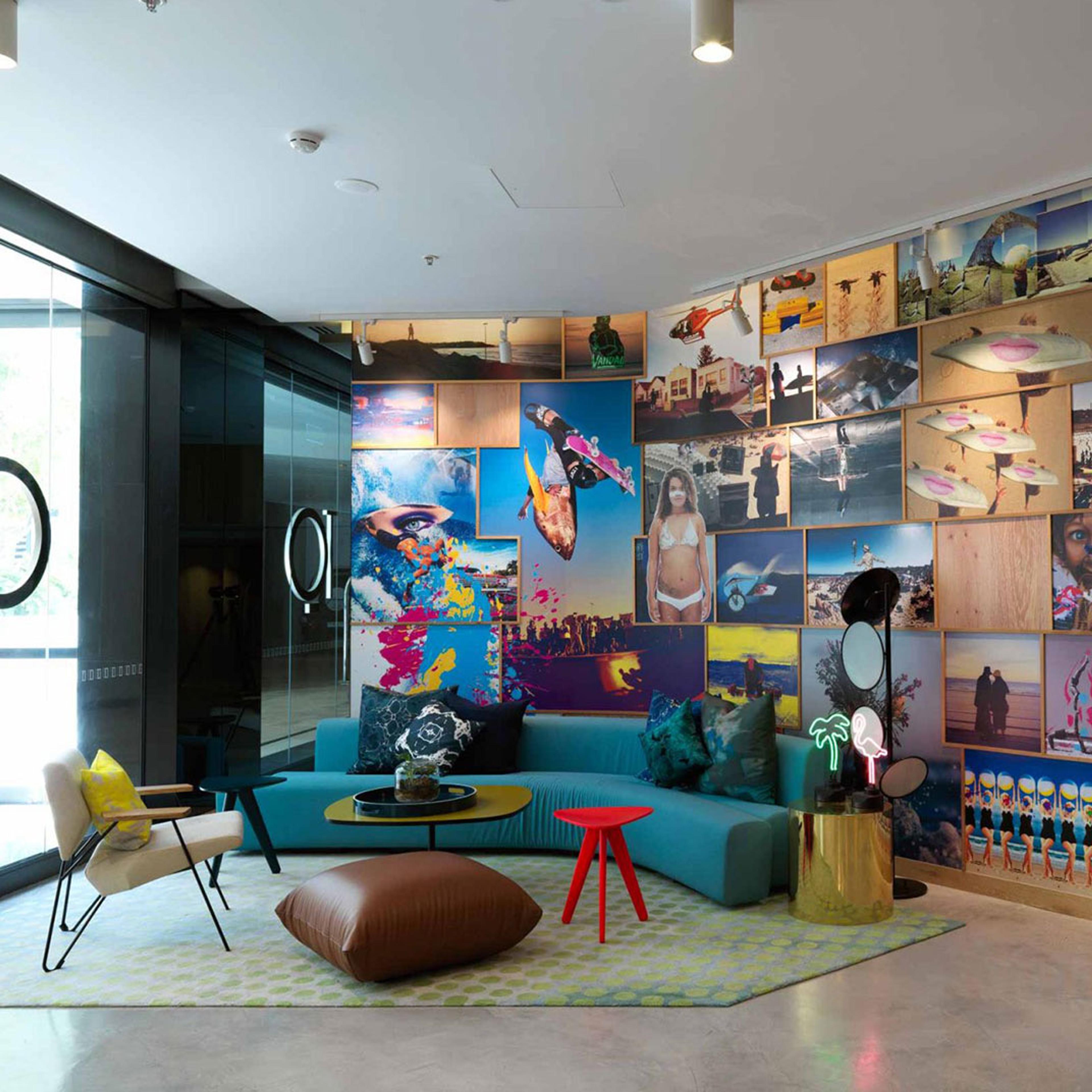 The lobby lounge, a colourful mural behind teal seating