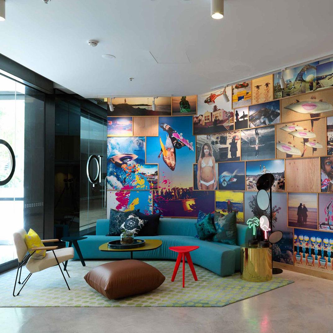 The lobby lounge, a colourful mural behind teal seating