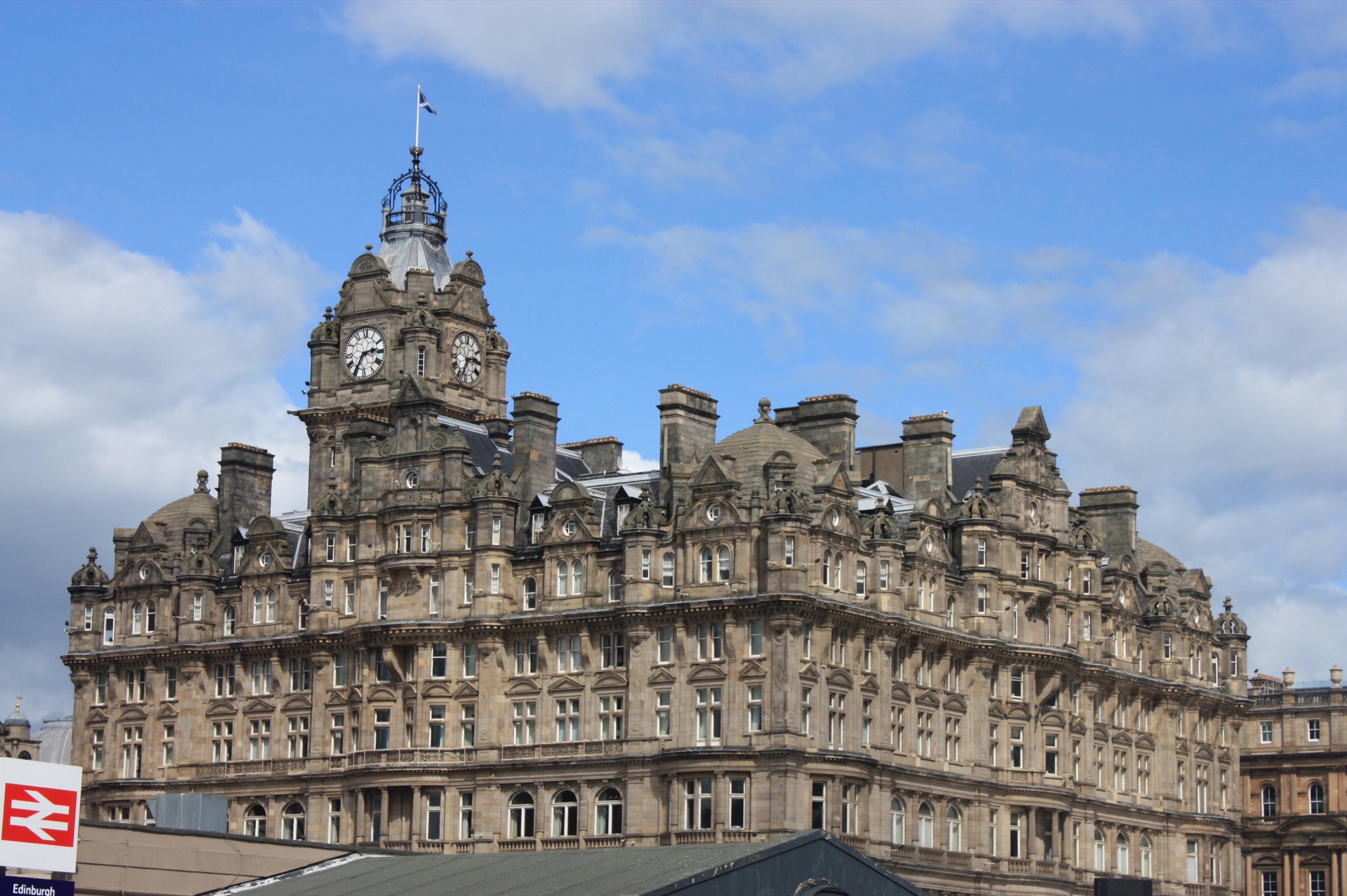 The full Victorian front of The Balmoral, its turrets, dormers and clock tower above the street.