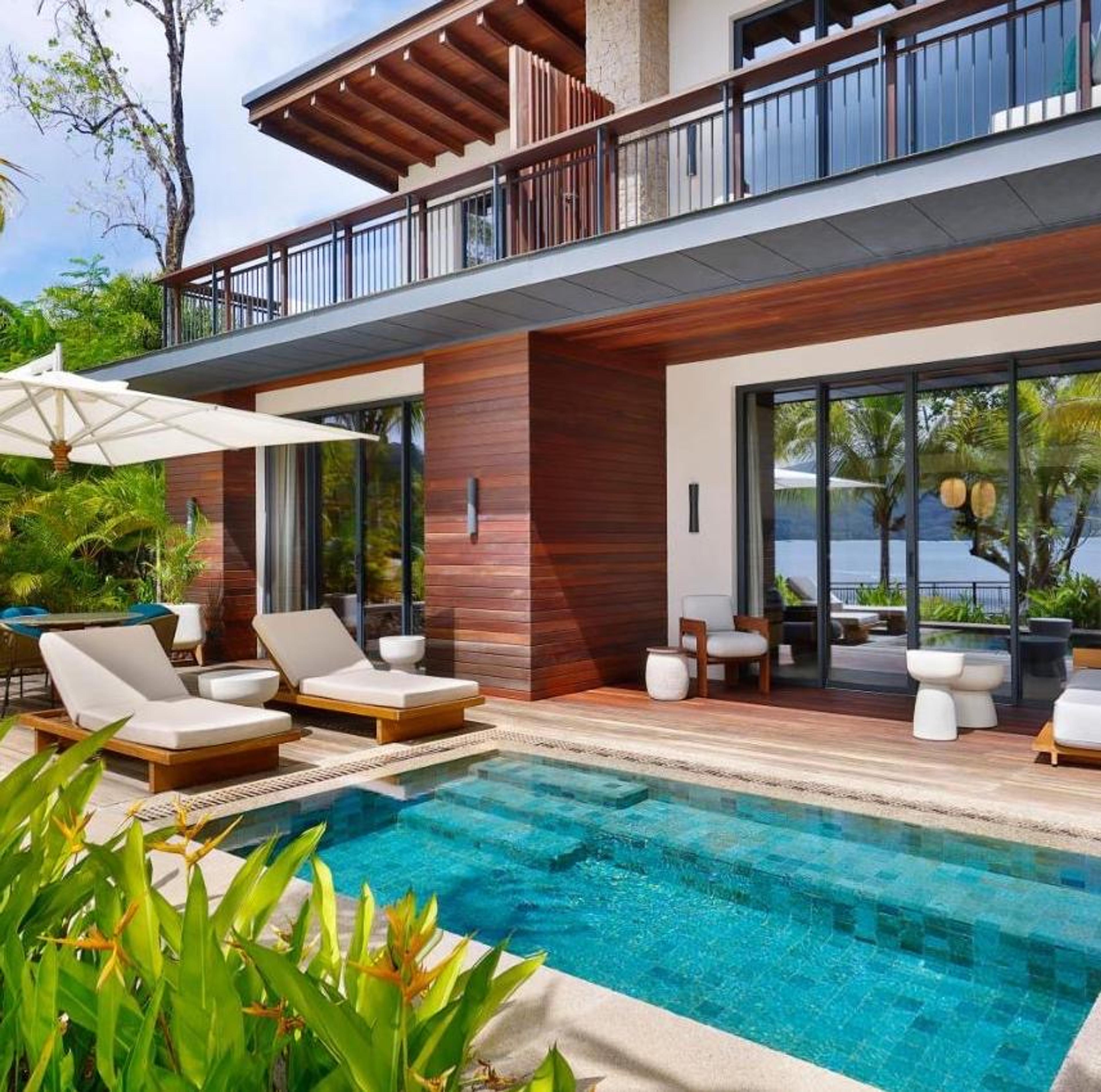 A suite's terrace with a plunge pool and the sea beyond
