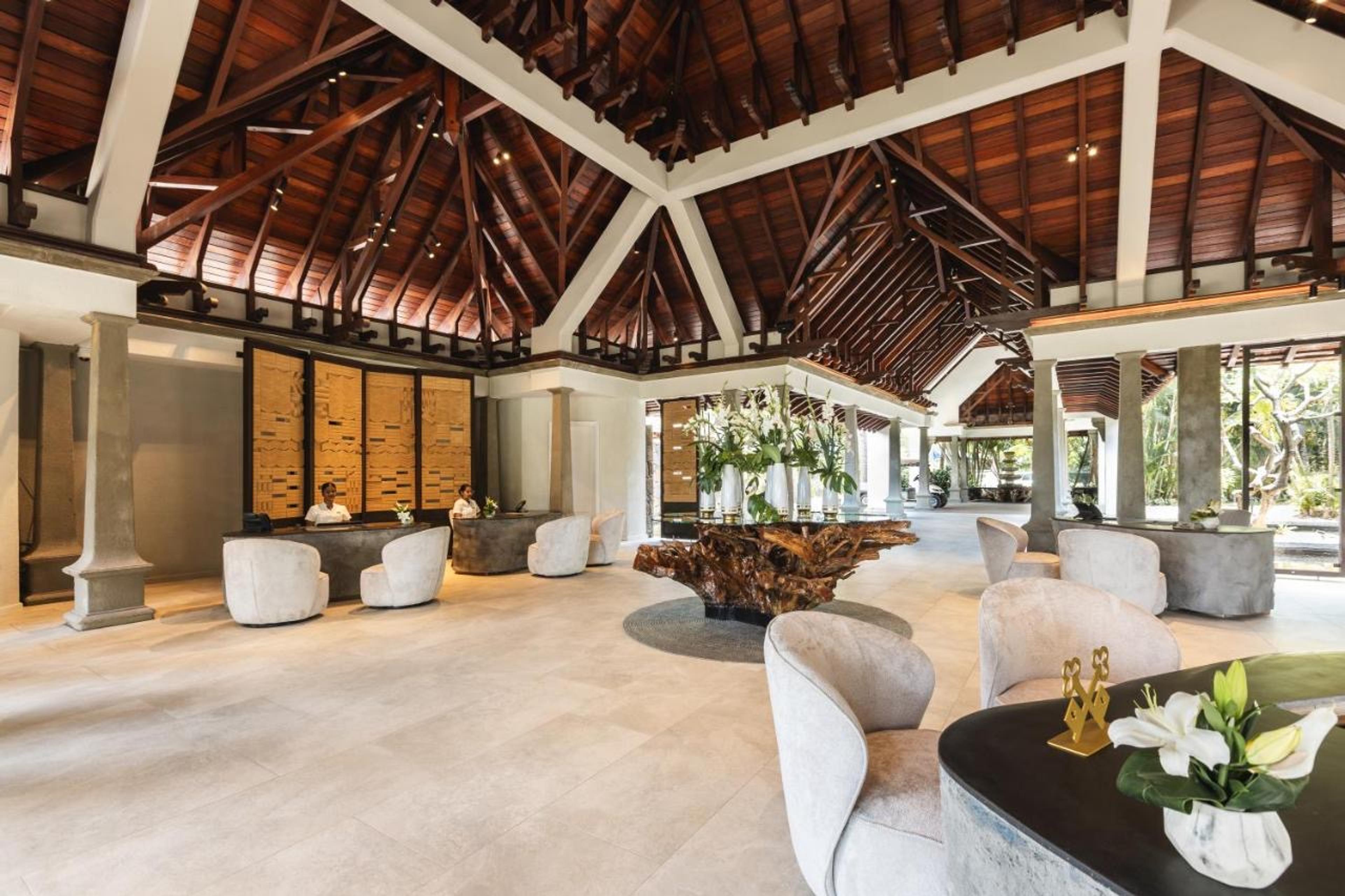 An open-sided lounge under a high timber roof