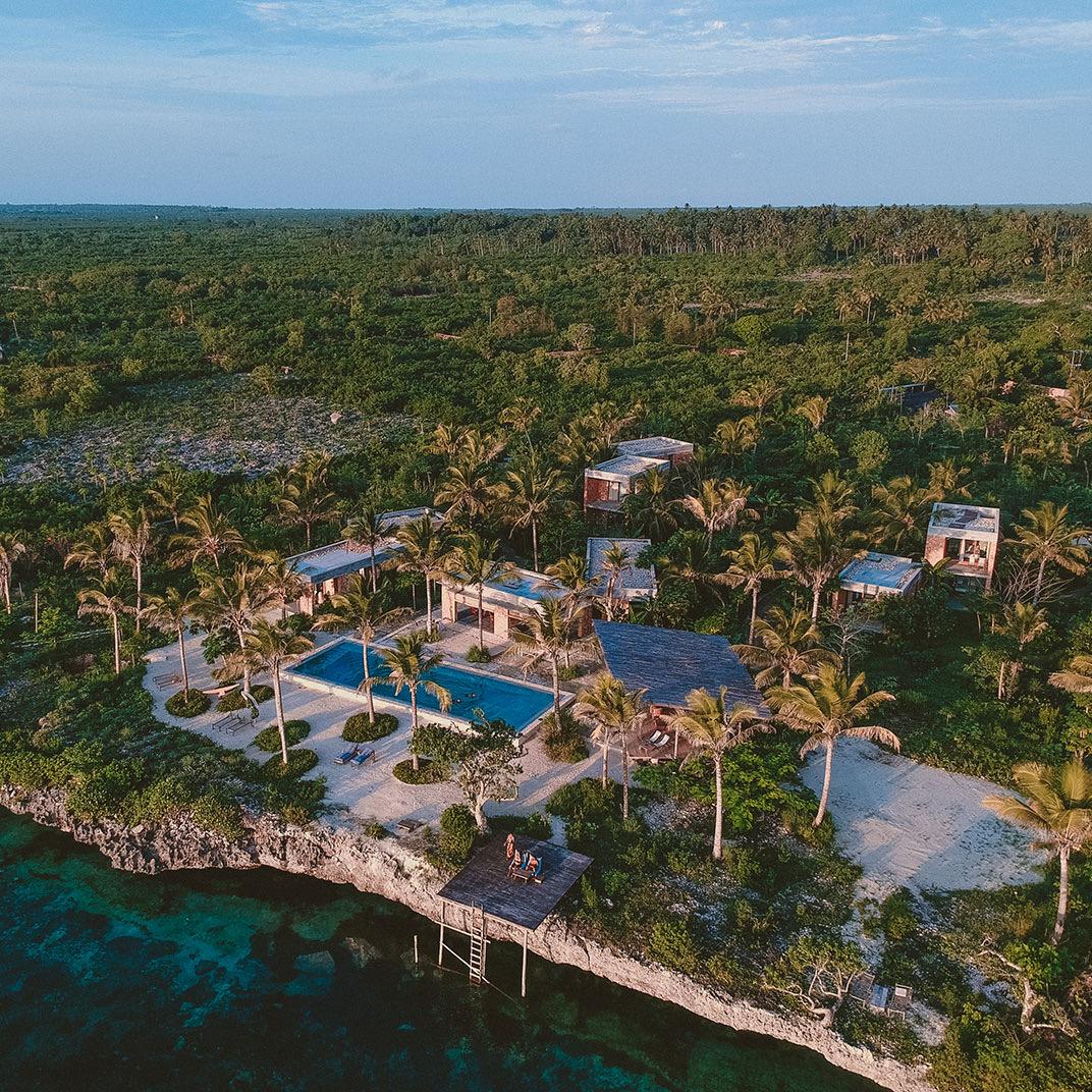 The hotel among the trees from the air