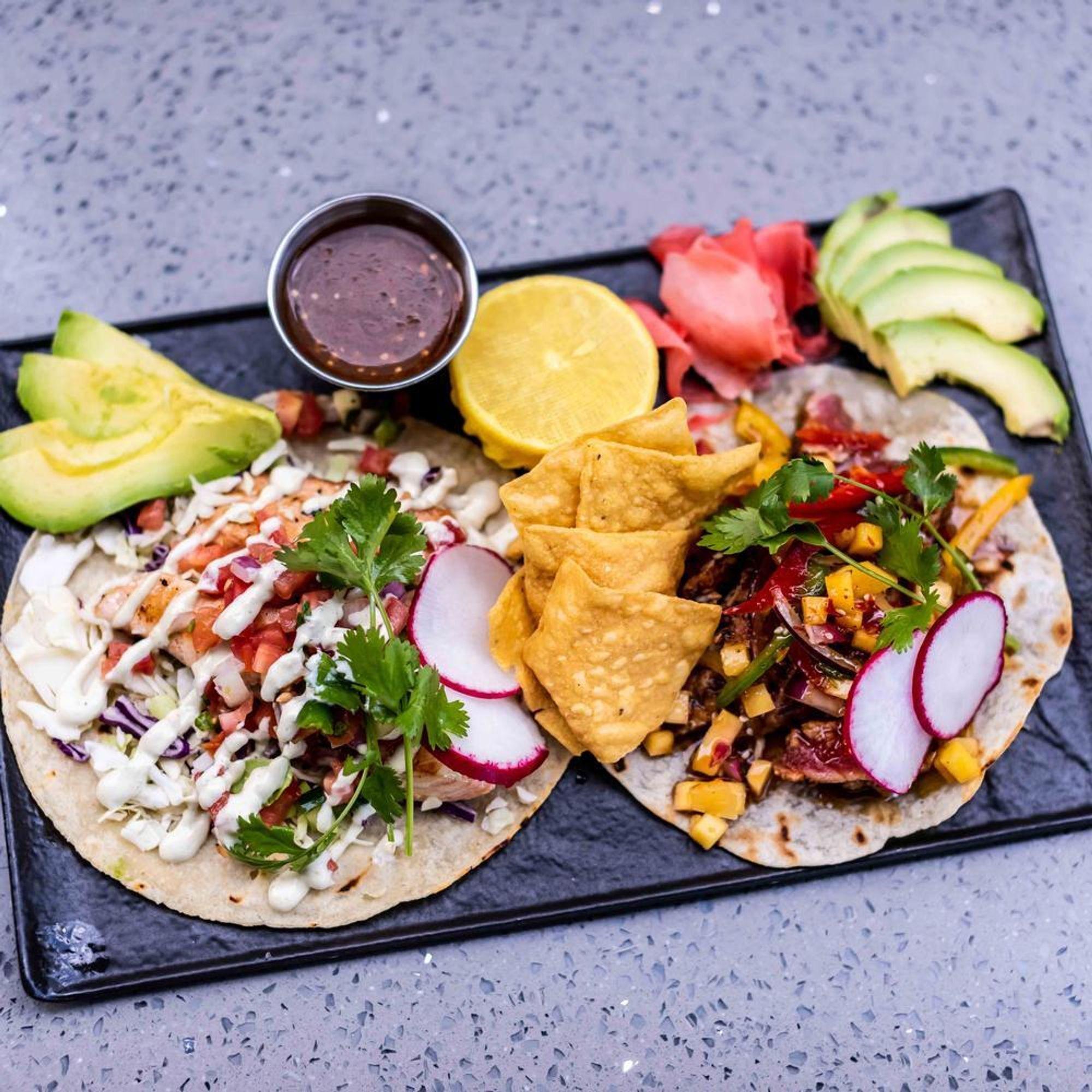 Tacos with radish, avocado and tortilla chips