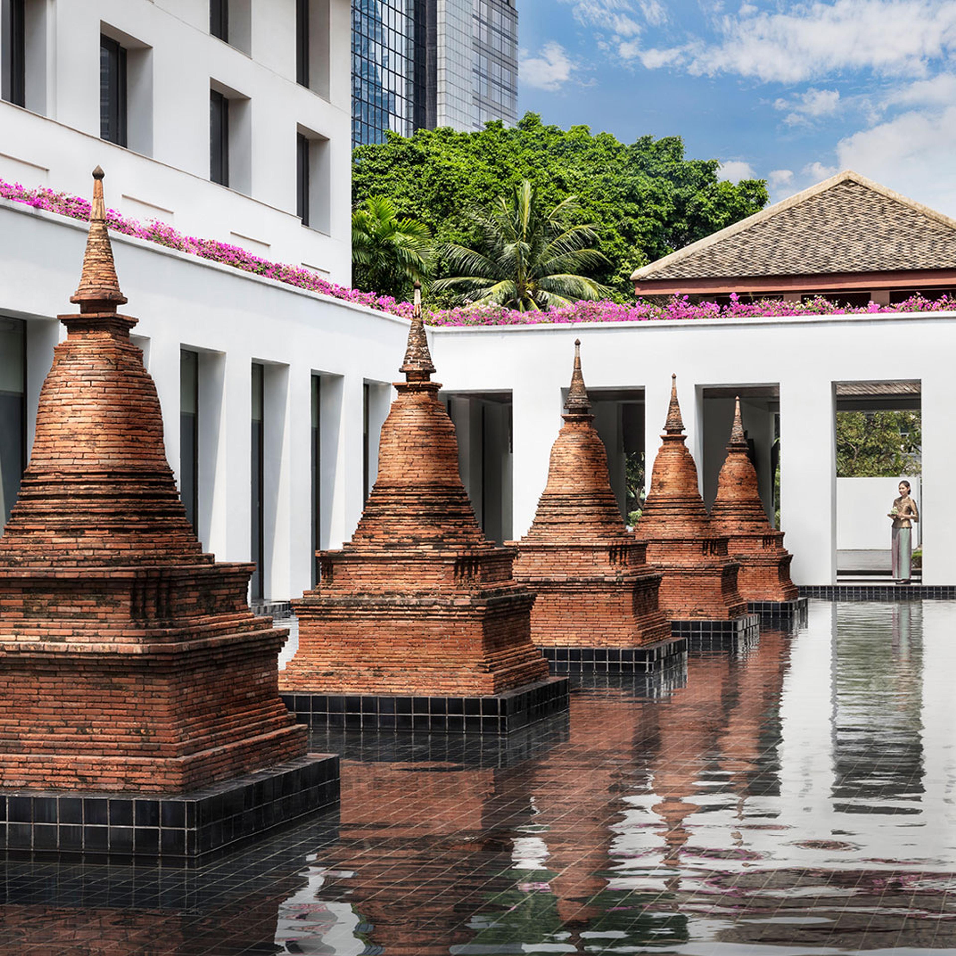 Brick chedis rising from a reflecting pool