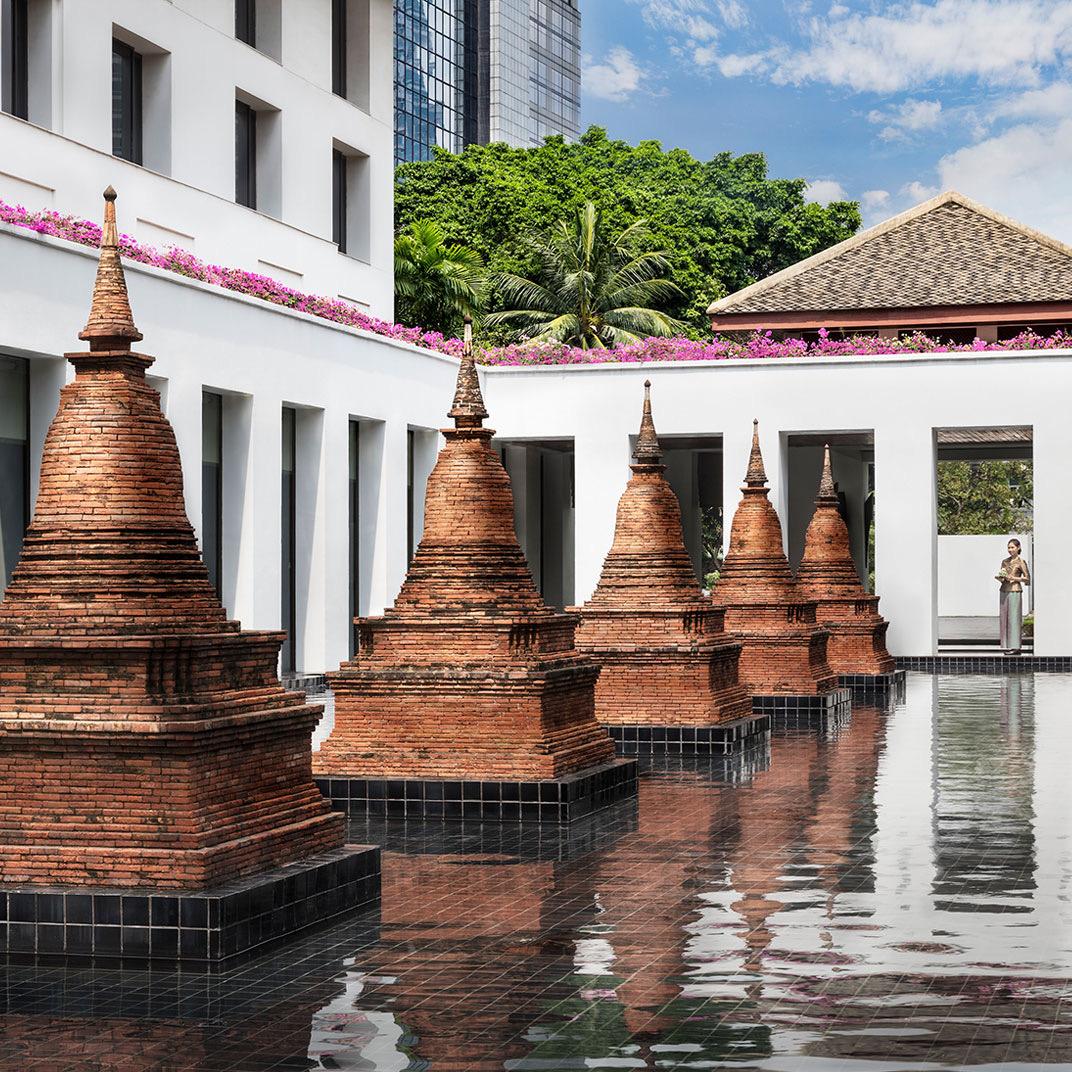 Brick chedis rising from a reflecting pool