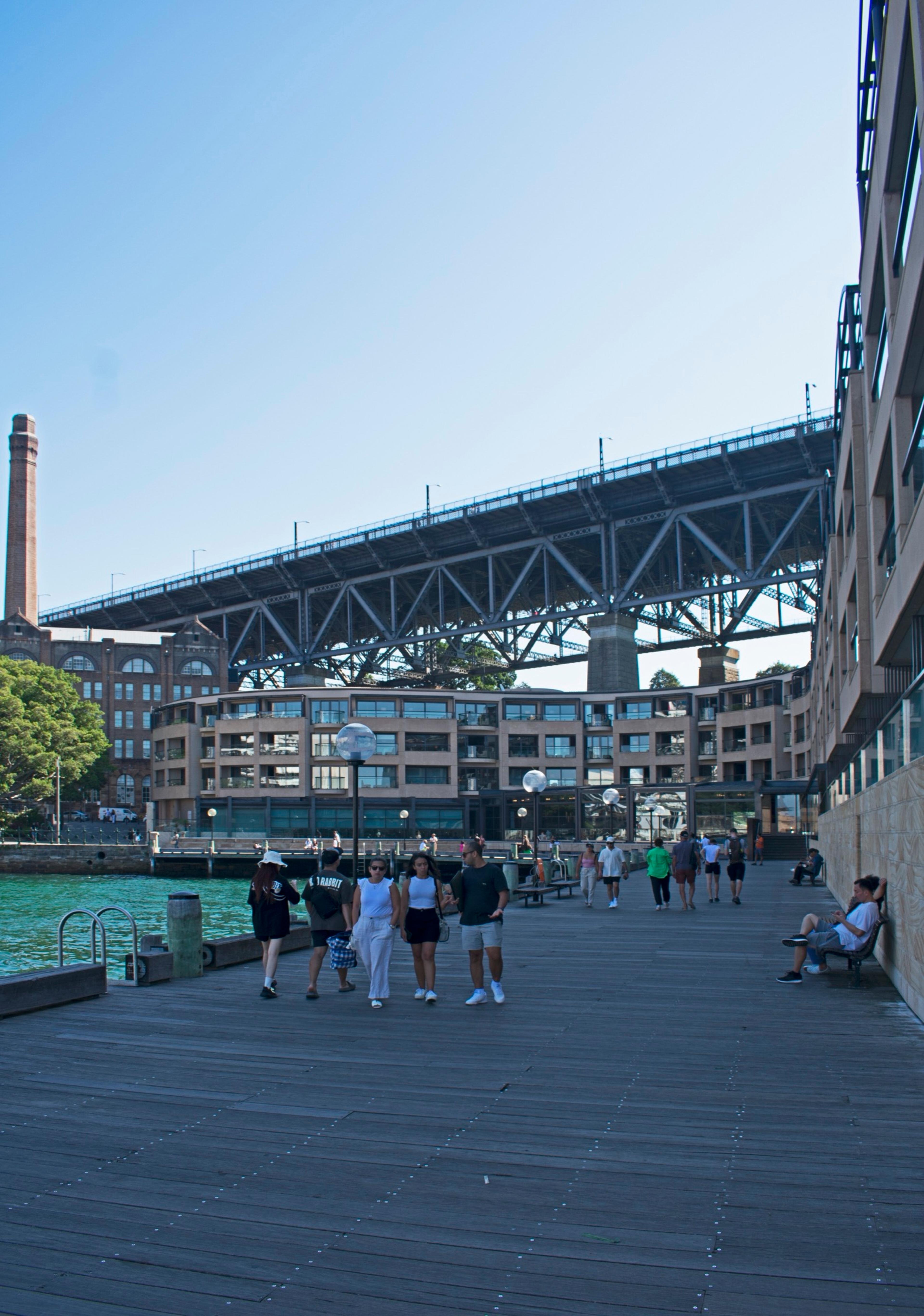 The hotel's waterfront terraces seen from the north-east, under the bridge approach