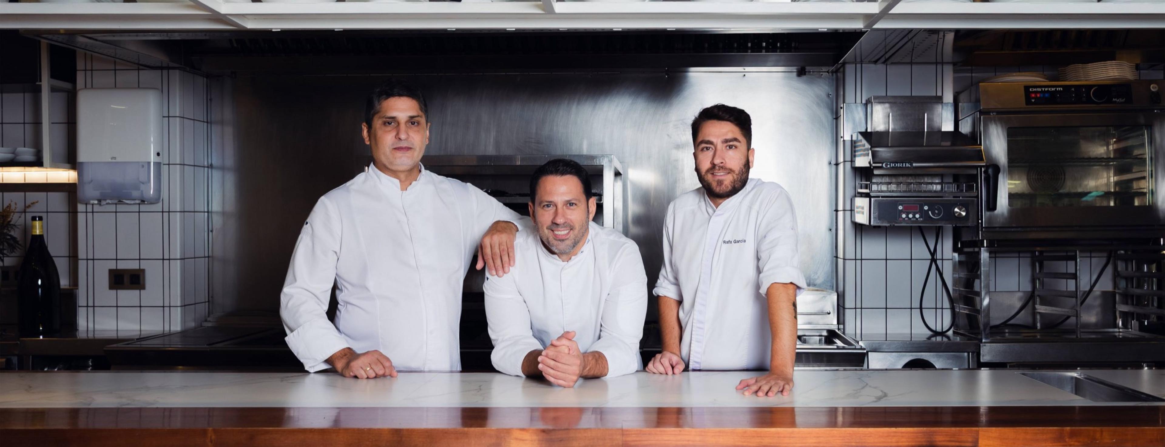 The chefs of Cañabota in whites at the kitchen pass