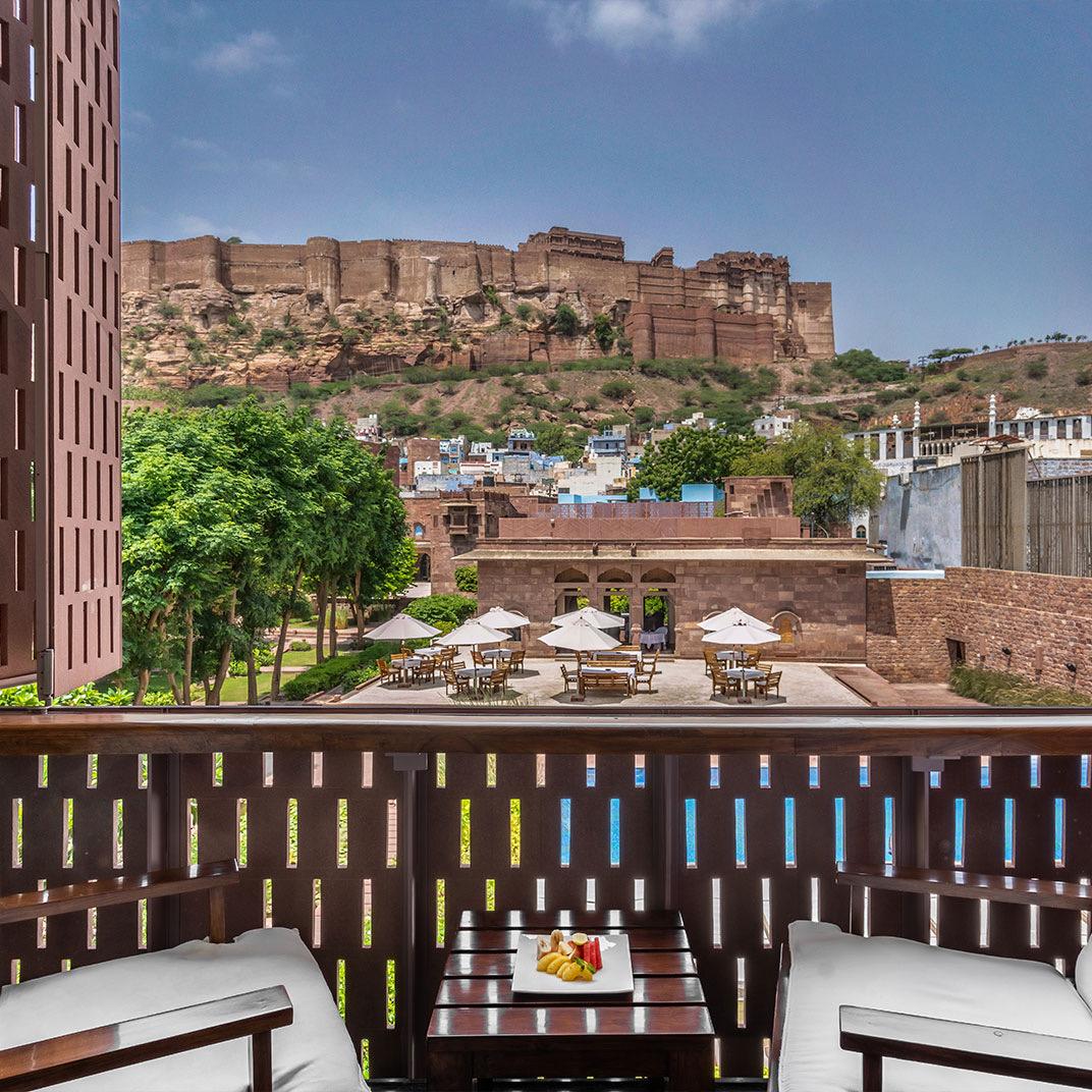 The hotel's buildings with Mehrangarh Fort on the rock above