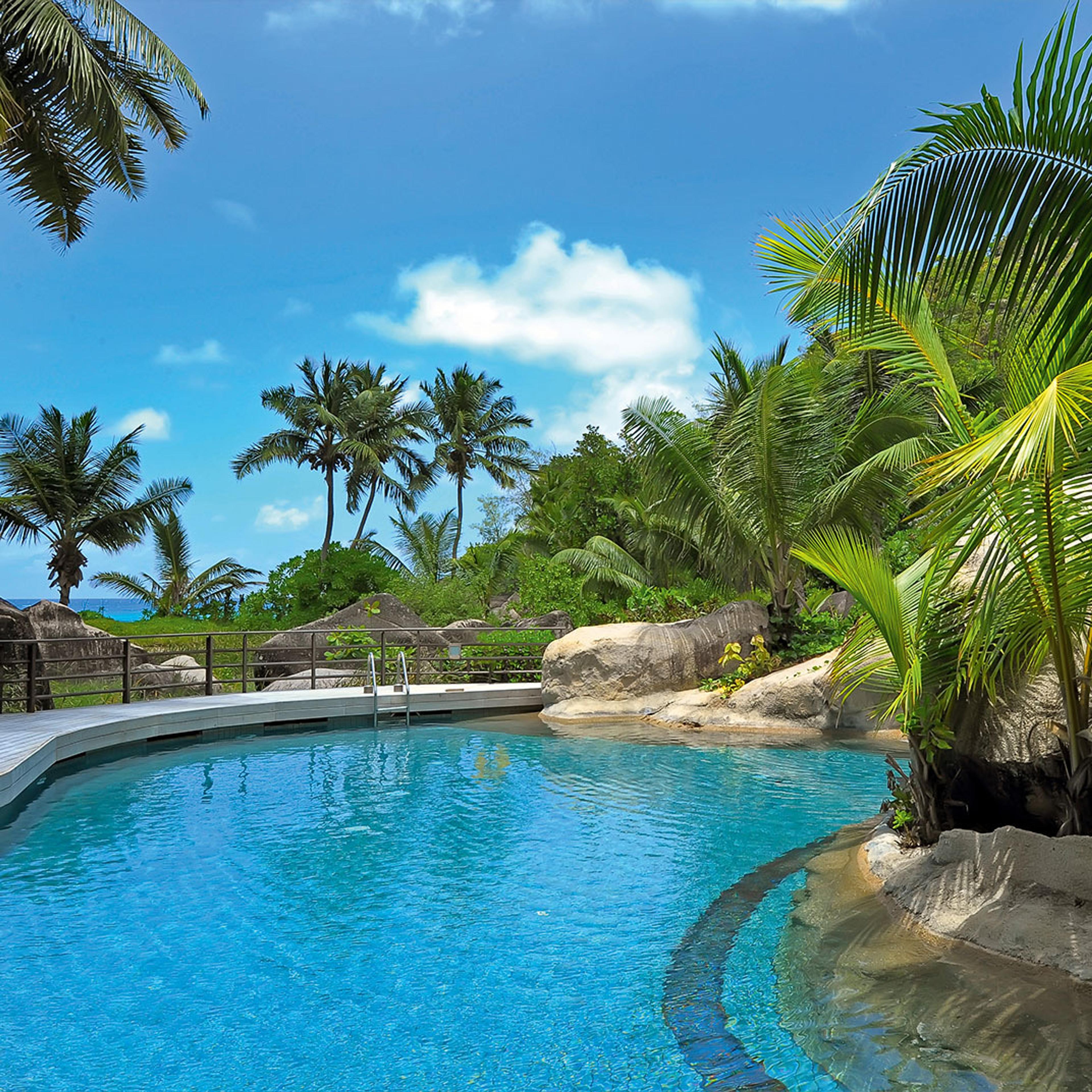 A pool among palms and granite