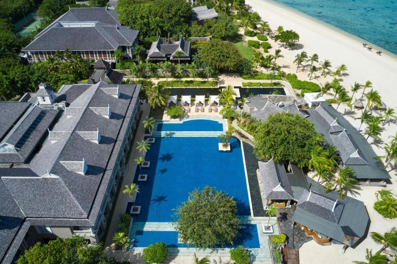 A long pool between the resort's buildings, seen from above