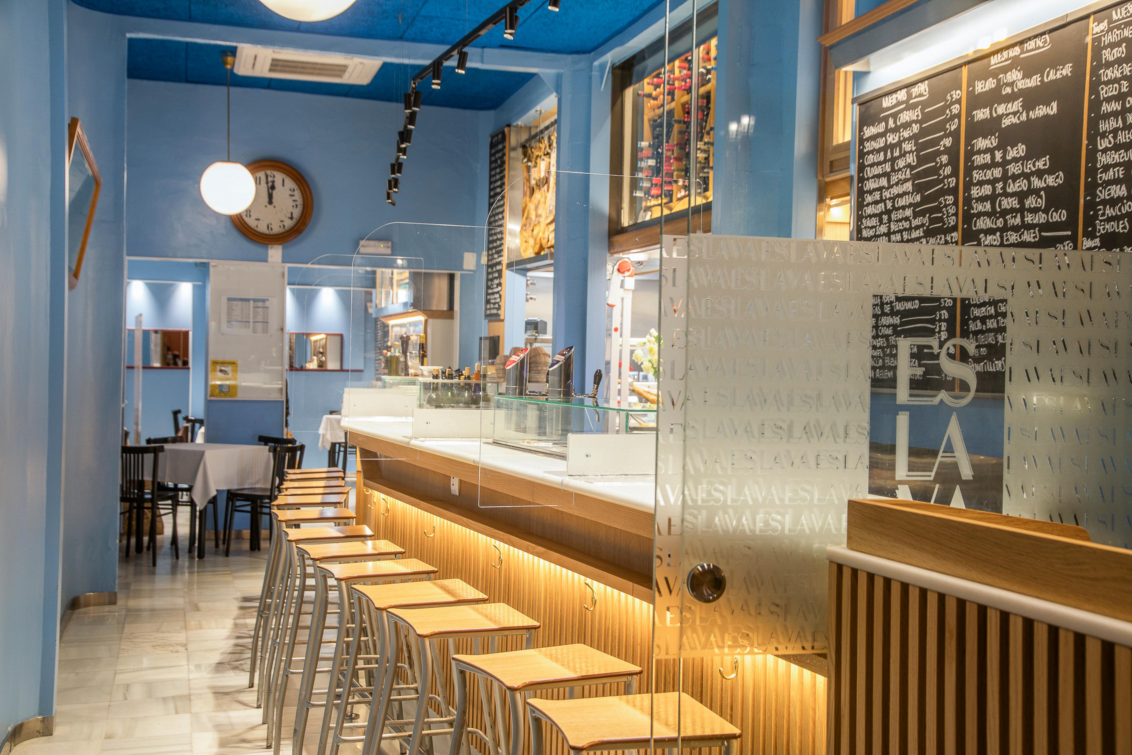 The tapas bar at Espacio Eslava, stools along a long wooden counter
