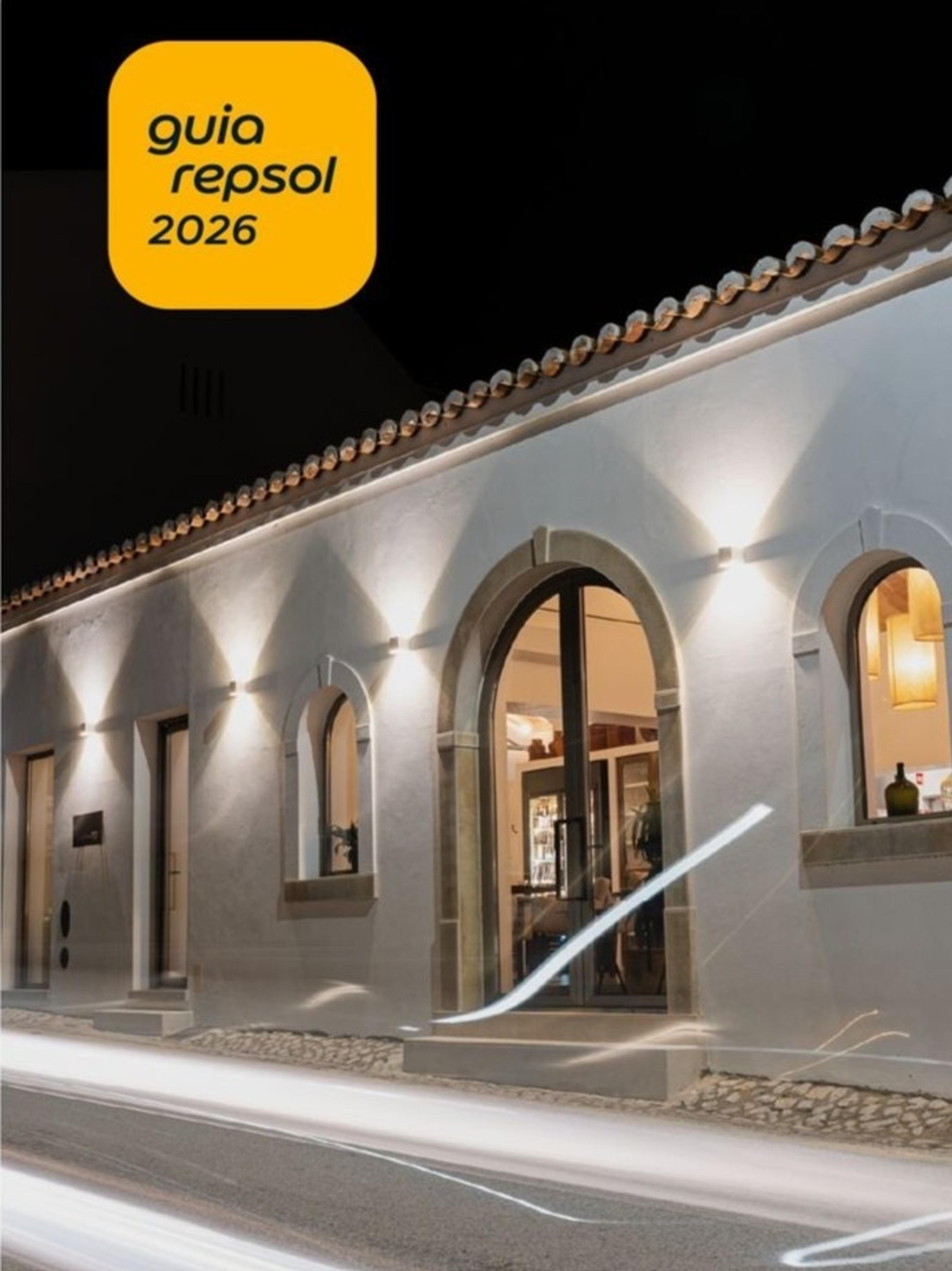 The whitewashed front of Mesa Farta near Tavira, lit at night