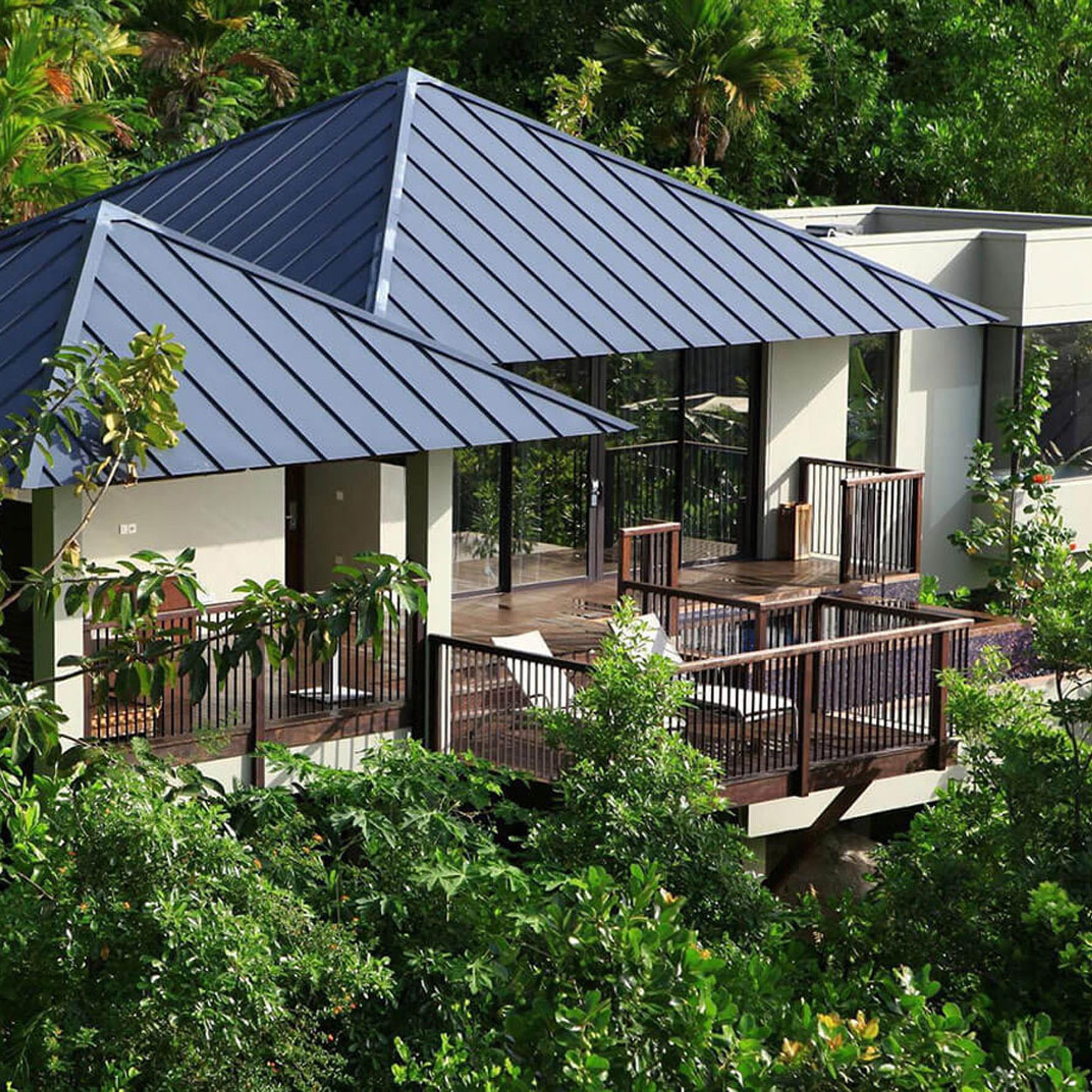 A villa with a timber deck among the tropical planting