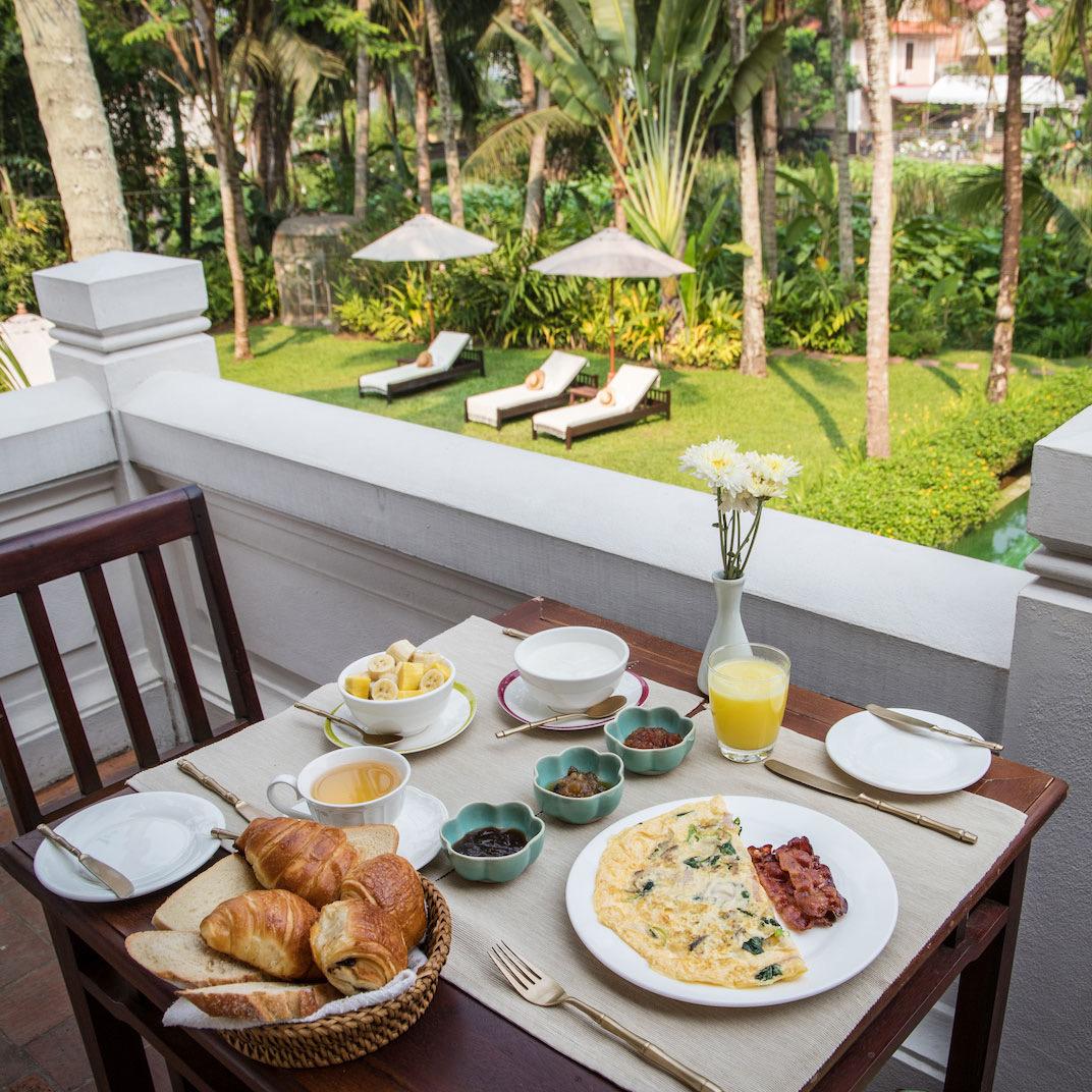Breakfast laid on a terrace above the garden
