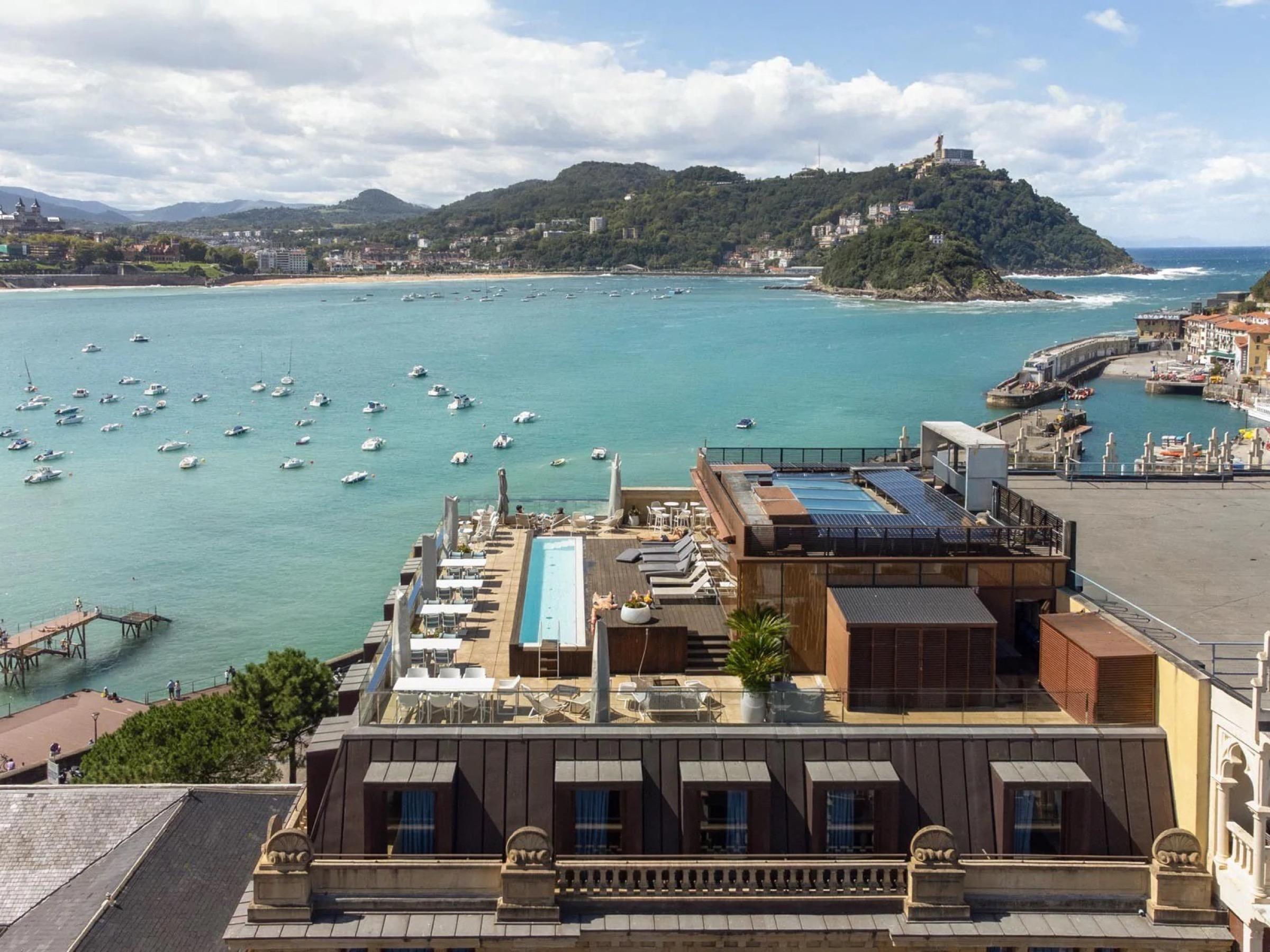 La Concha bay from the roof of Lasala Plaza in the Old Town, boats moored in the bay and Santa Clara island beyond