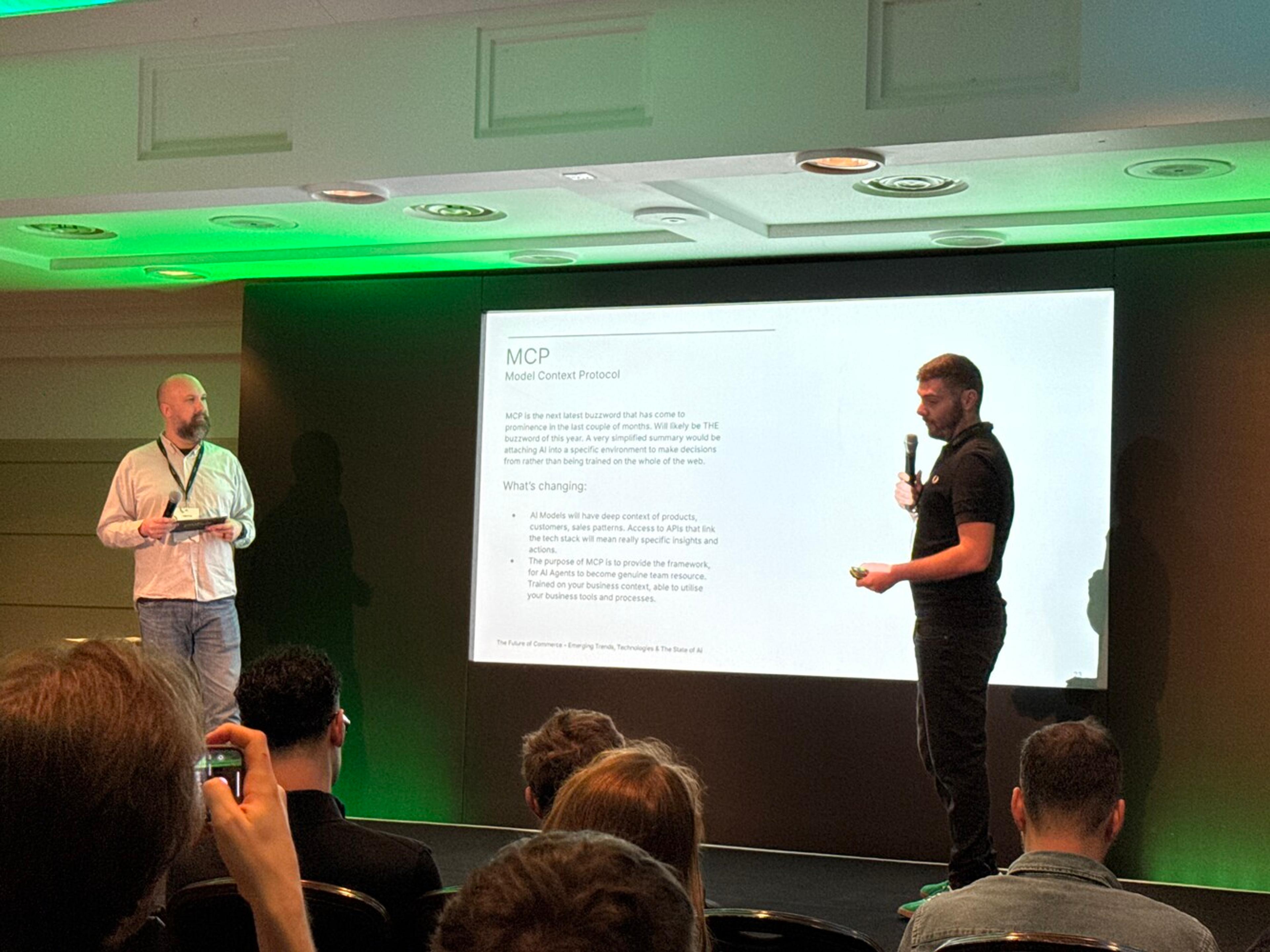 Liam Quinn and Barrett Ahern from Vervaunt on stage, discussing AI and Model Context Protocol