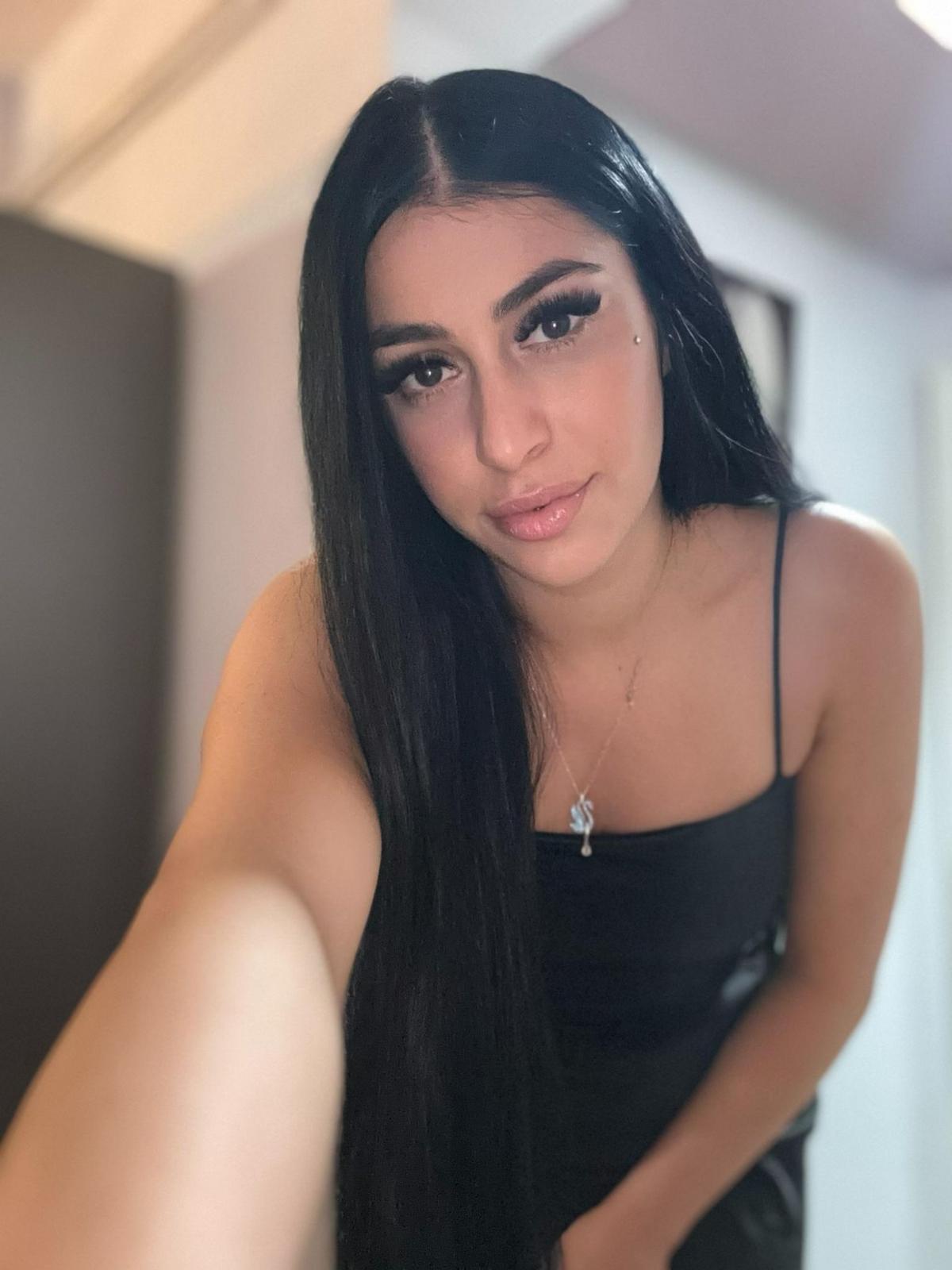 Aliya, a sophisticated London escort taking a selfie Aliya, a sophisticated London escort taking a selfie