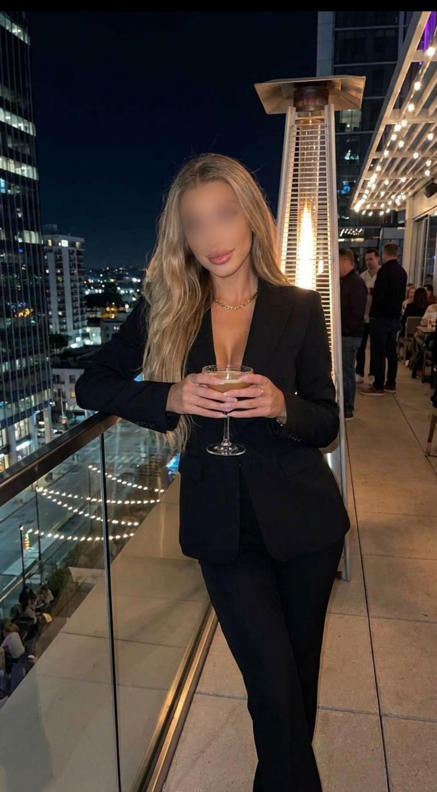 Celina Europeaan escort poses in a sexy black suit London,