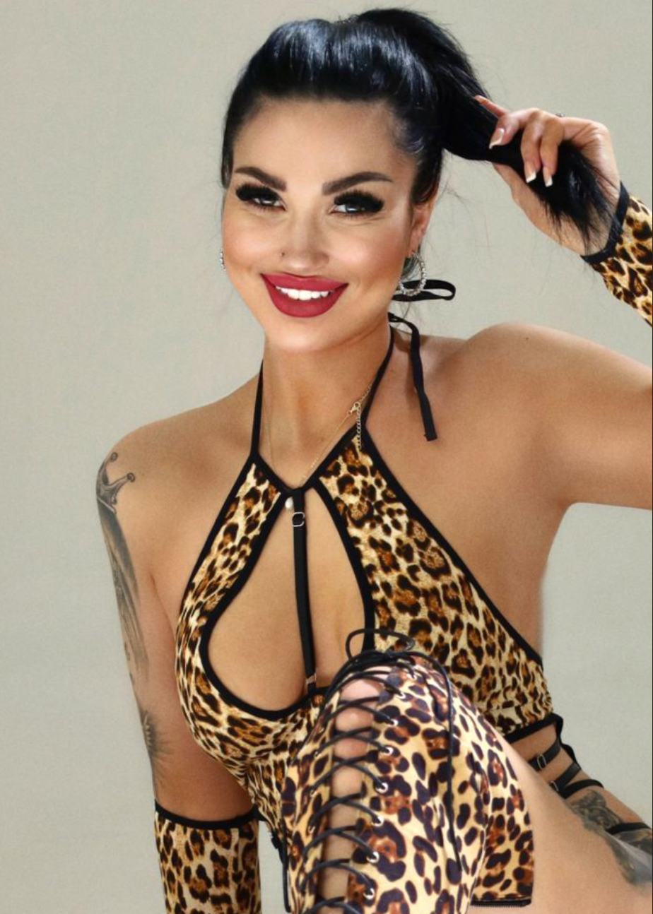 Polly London escort poses in a lepard print lingerie Polly London escort poses in a lepard print lingerie