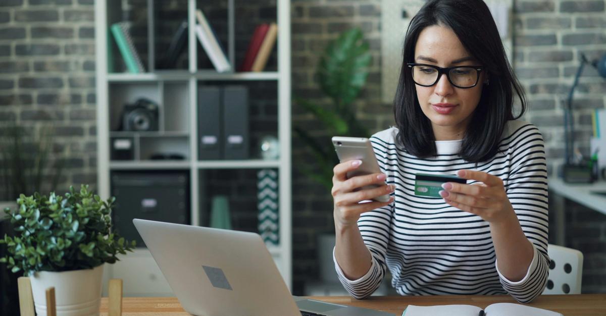 Woman preparing to call credit card company by vitaly gariev.