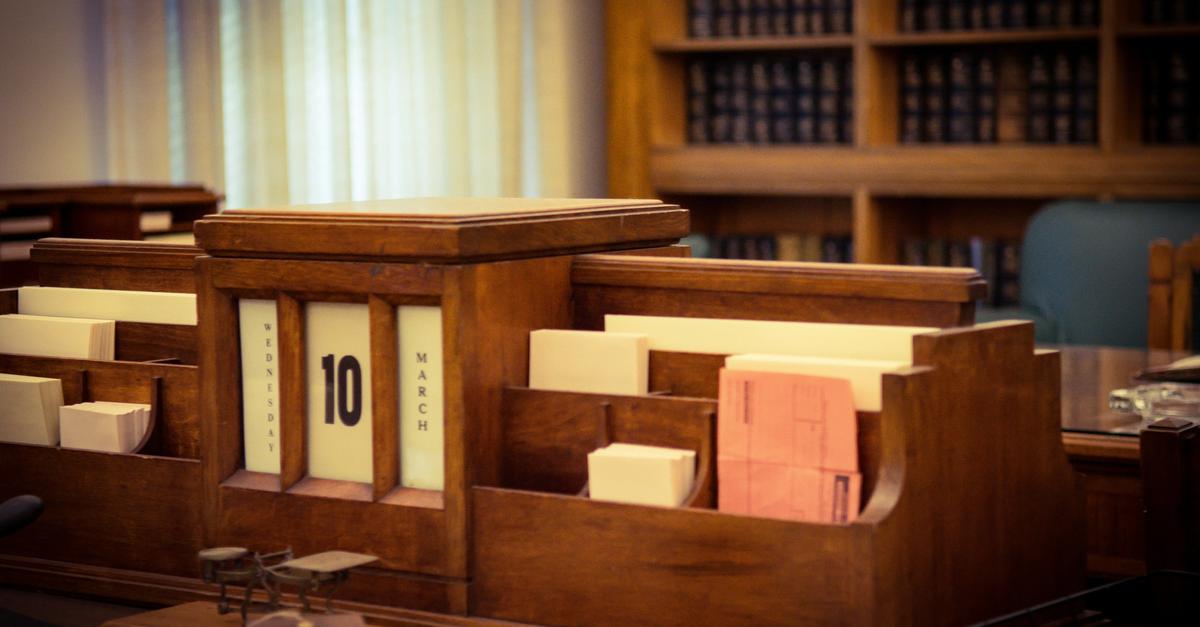 Desk with court filings sitting atop it.
