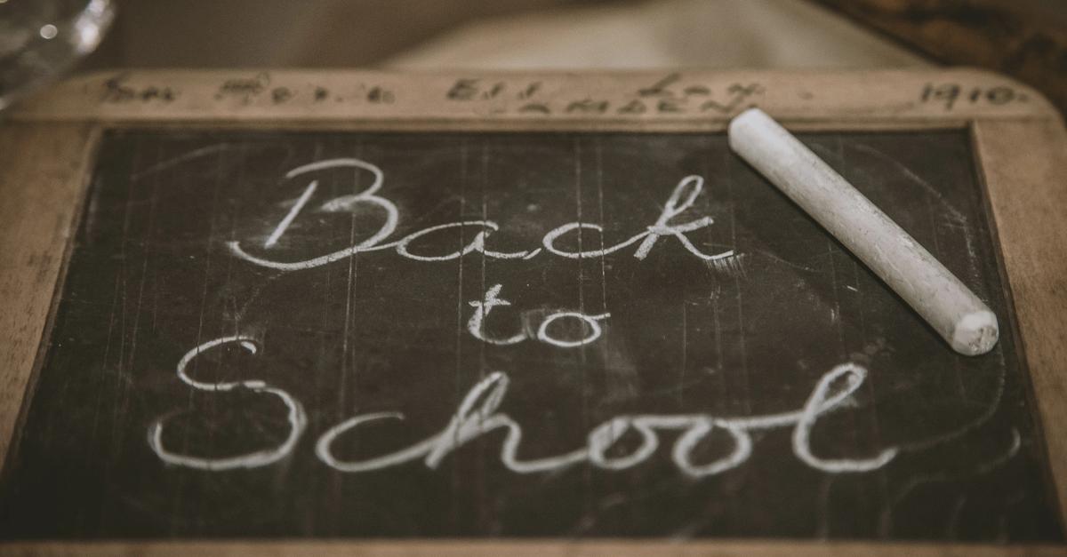 Back to school written on chalkboard.