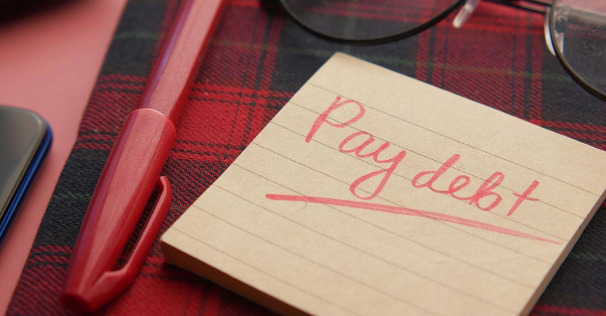 Posted note that says pay debt on it by Towfiqu Barbhuiya.