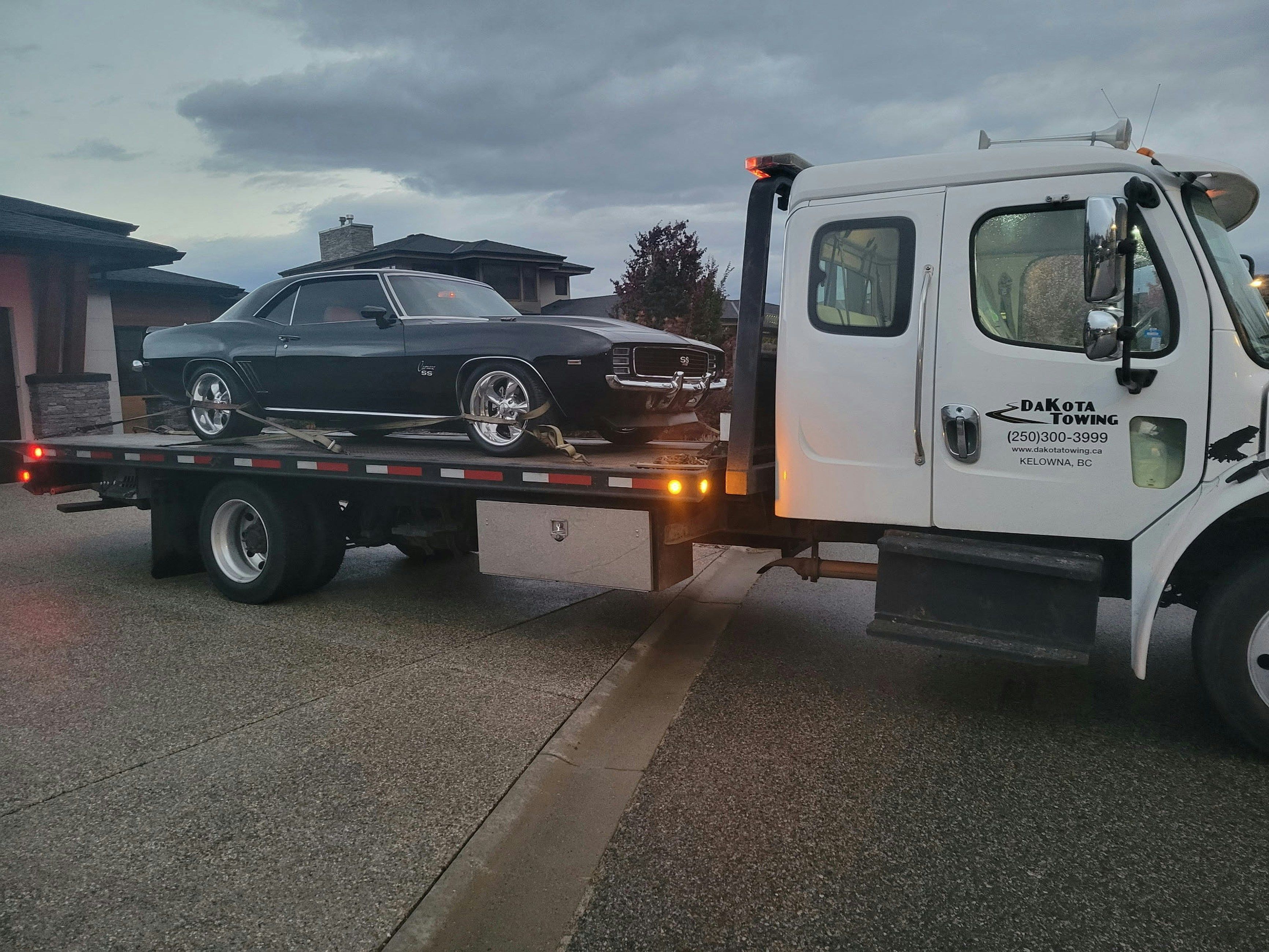 Car being towed and repossessed by Dakota Towing inc.