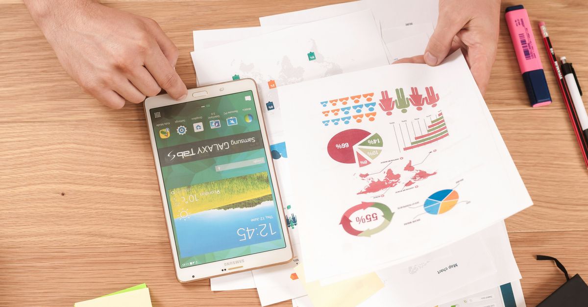 Individual performing a financial analysis and looking at a debt to income ratio.