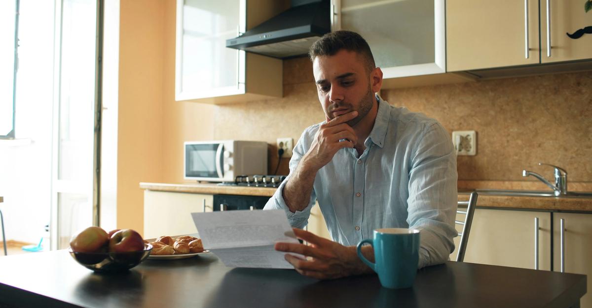 Man contemplating how to handle his credit card bills.
