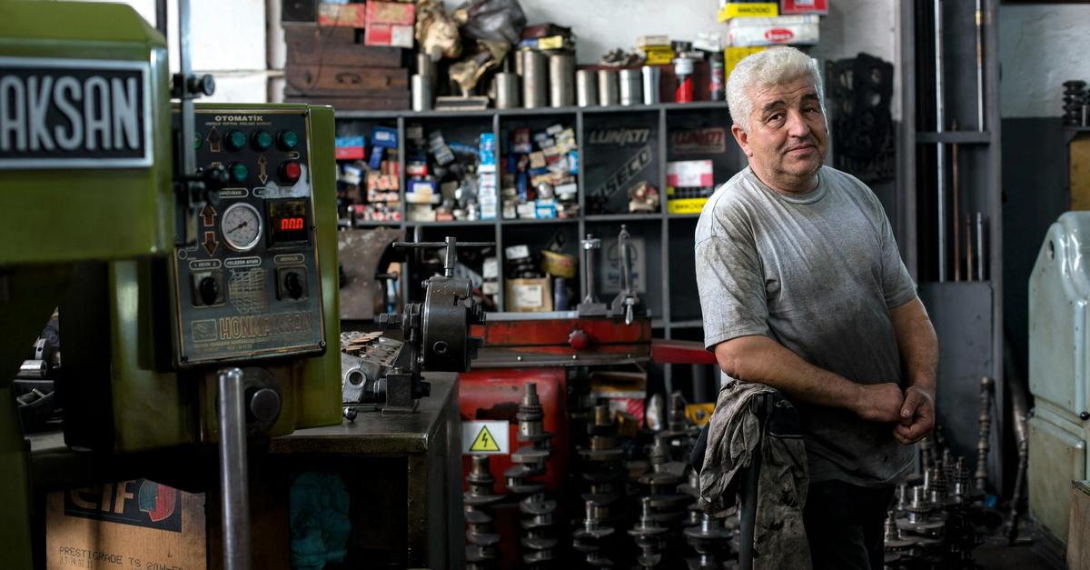 Small business owner in auto body shop by Alev Takil.