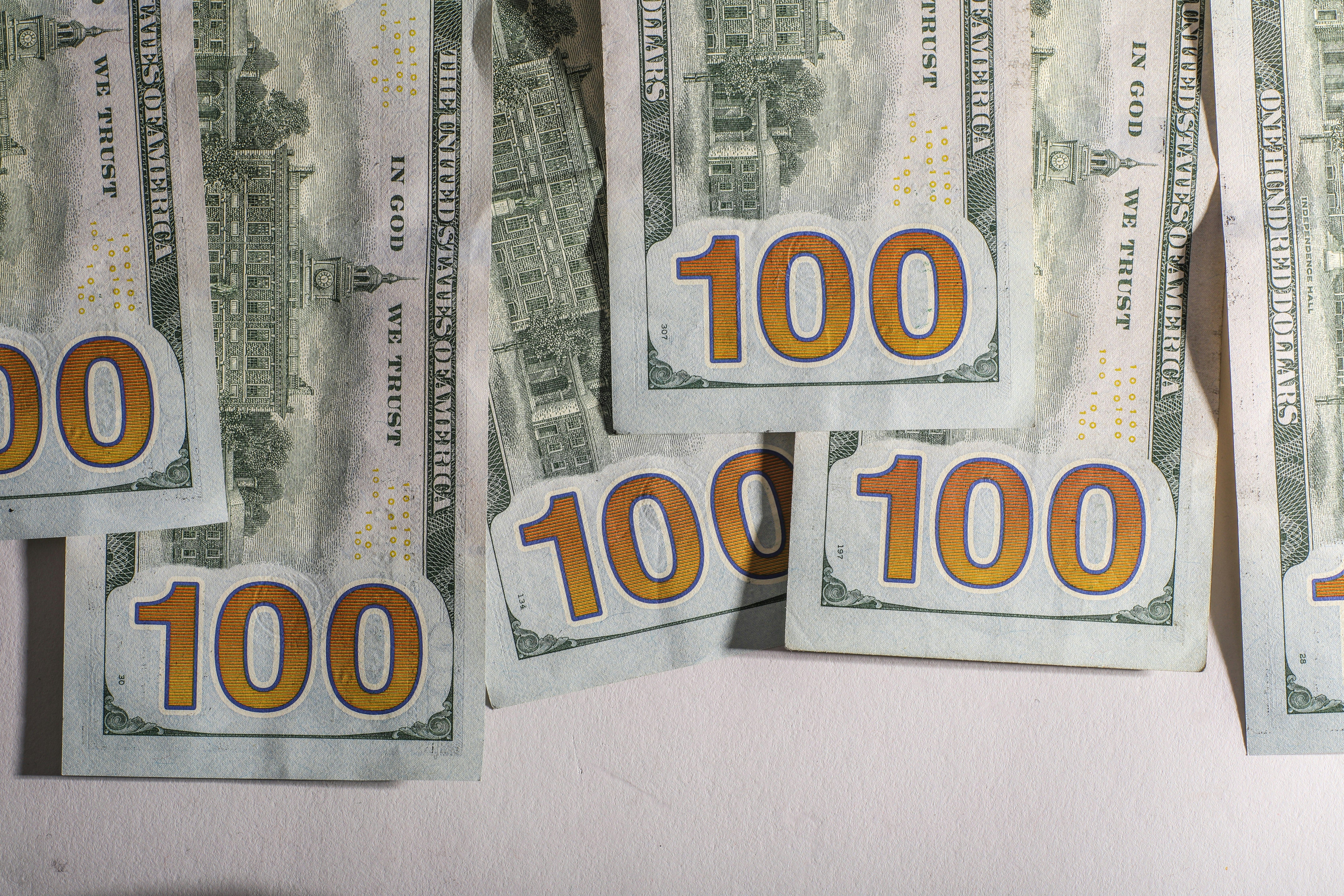 Backside of hundred dollar bills.
