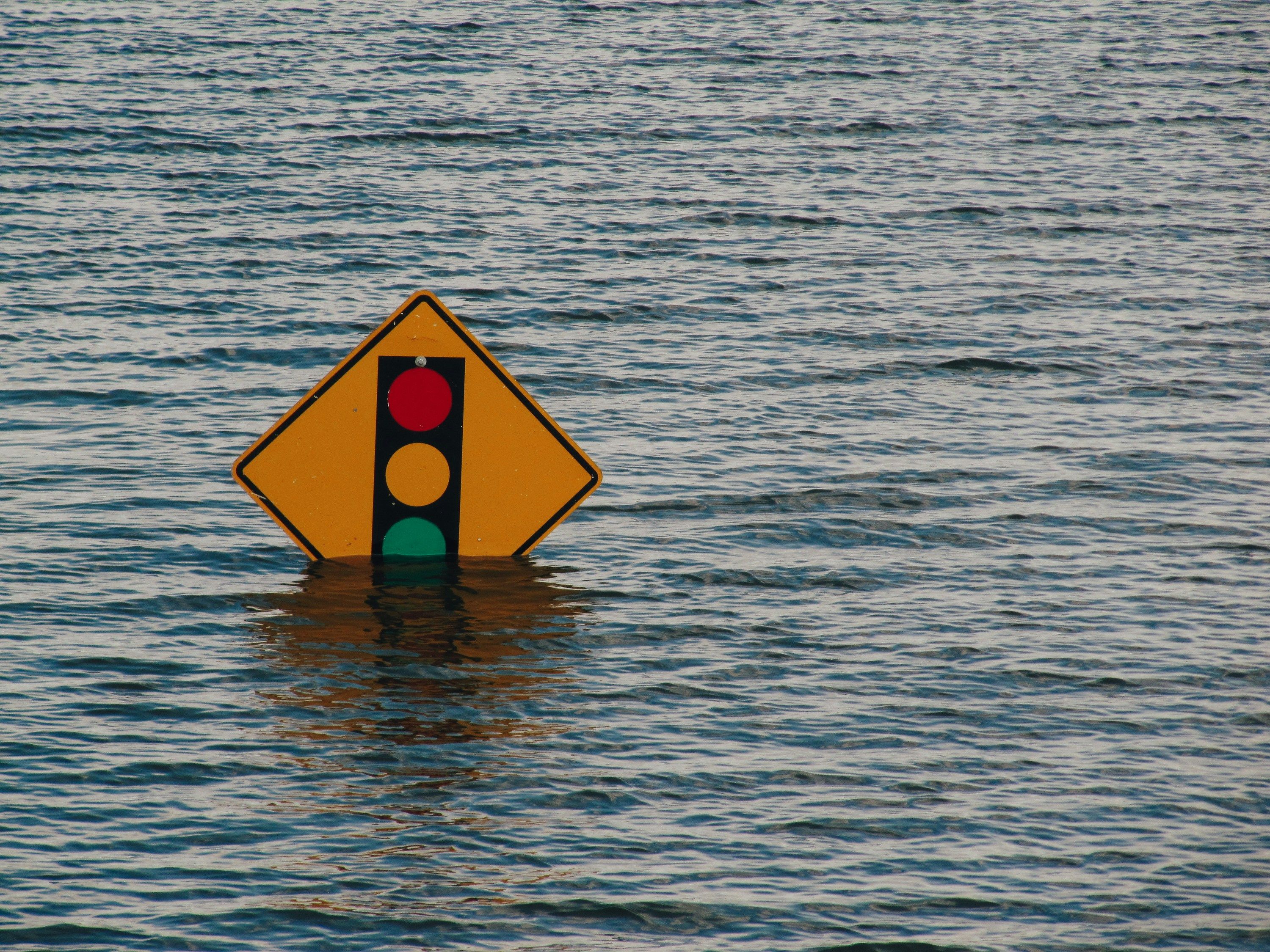 Traffic sign underwater due to natural disaster by Kelly Sikkema.