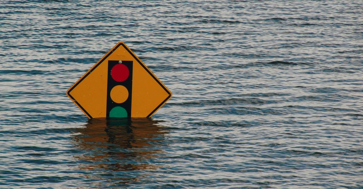 Traffic sign underwater due to natural disaster by Kelly Sikkema.