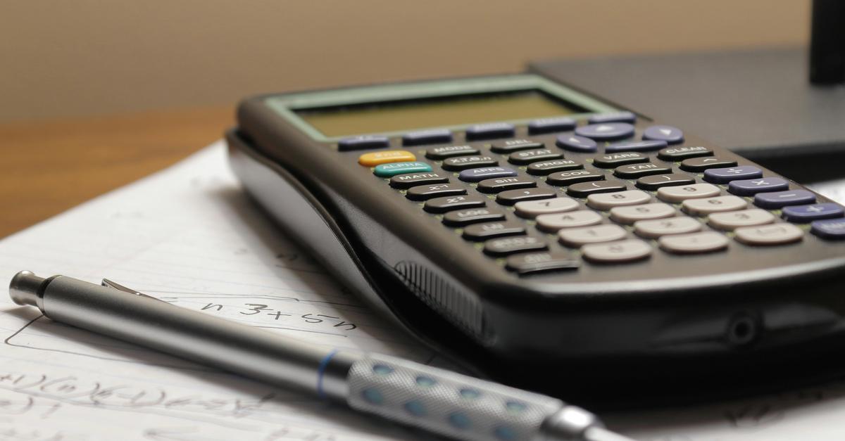 TI-83 calculator and a mechanical pencil perform math problem by Aaron Lefler.