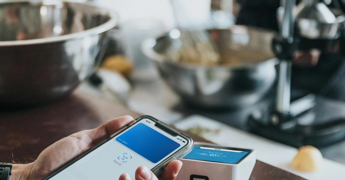 Credit card processor/reader executing a transaction in a shop.