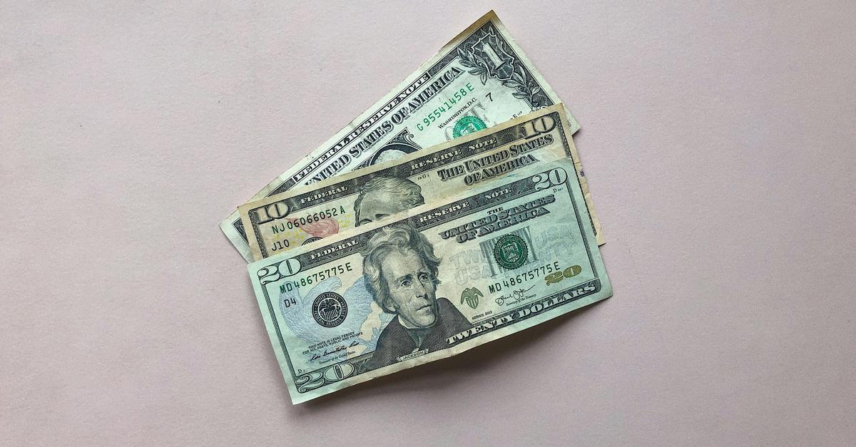 A $20 bill, a $10 bill and a $1 bill by Ryan Quintal.