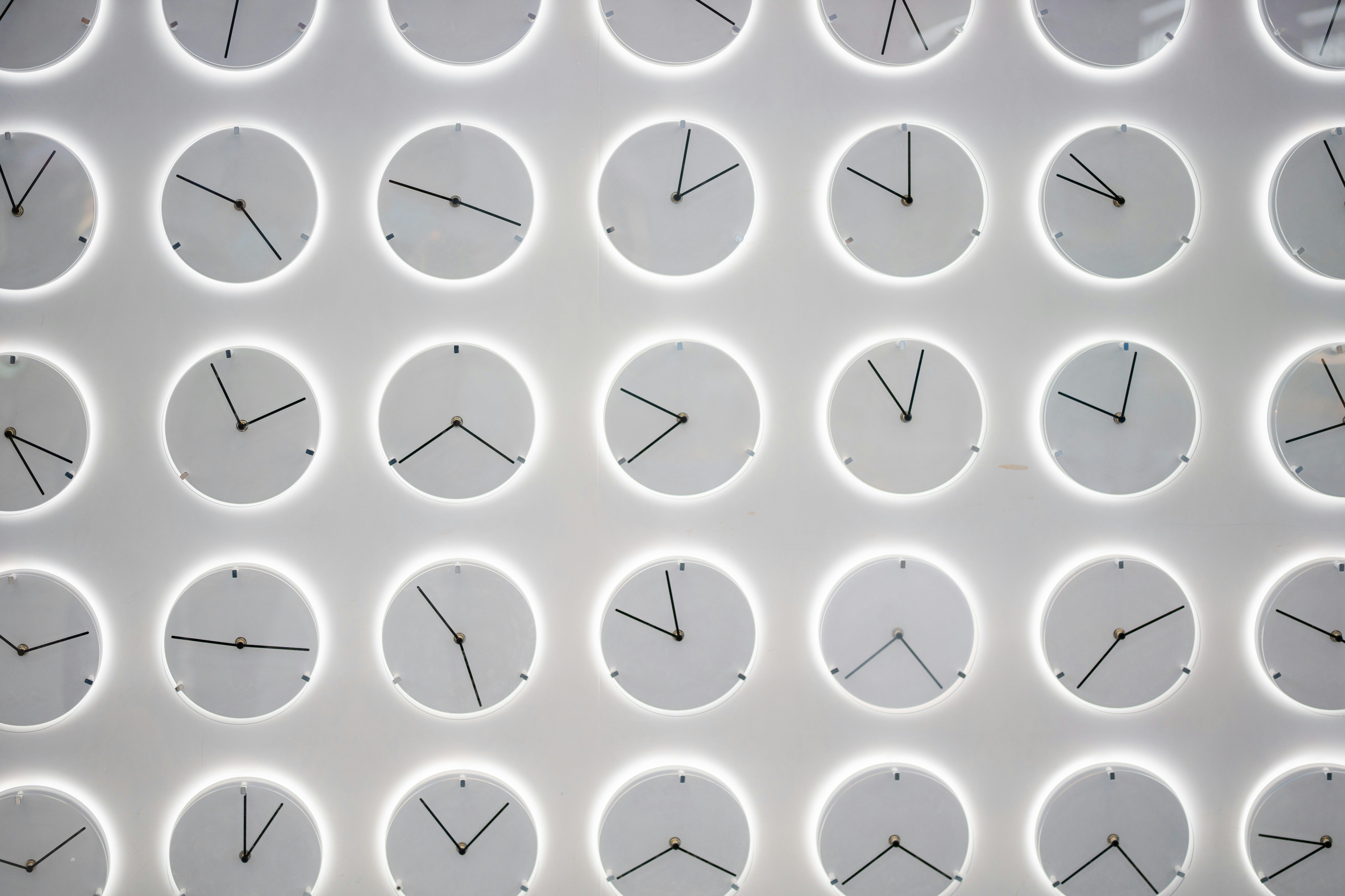 White clocks on a wall.
