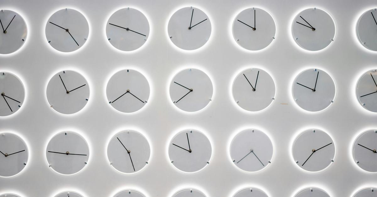 White clocks on a wall.