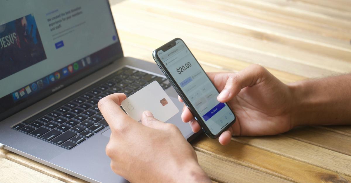 Consumers making a purchase using a credit card by Michael Lima.