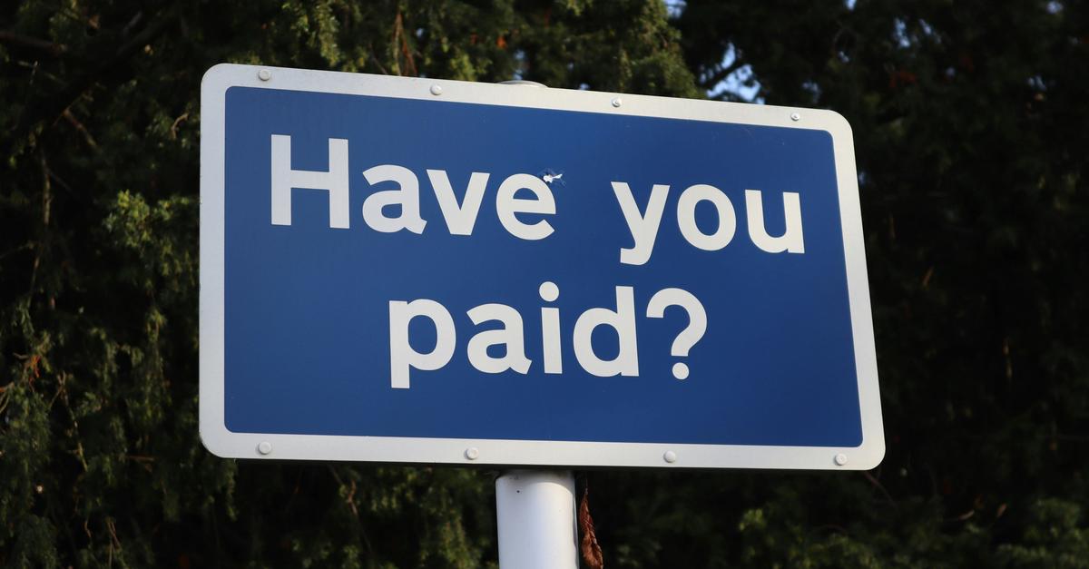 Blue sign stating "Have You Paid?" by call me Fred.