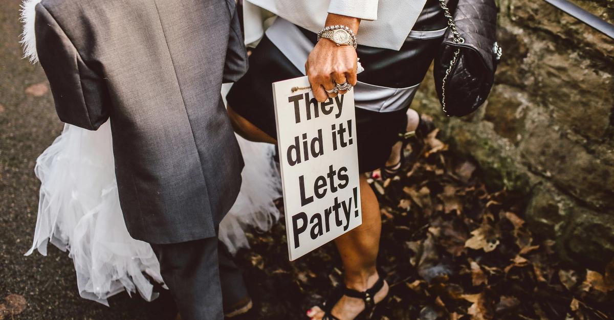 After wedding sign saying "They did it! Lets party!" by Thomas William