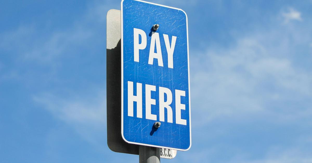 Blue sign saying "pay here".