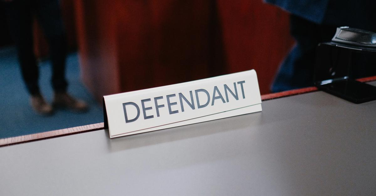 Defendant sign in court room by Wesley Tingey.