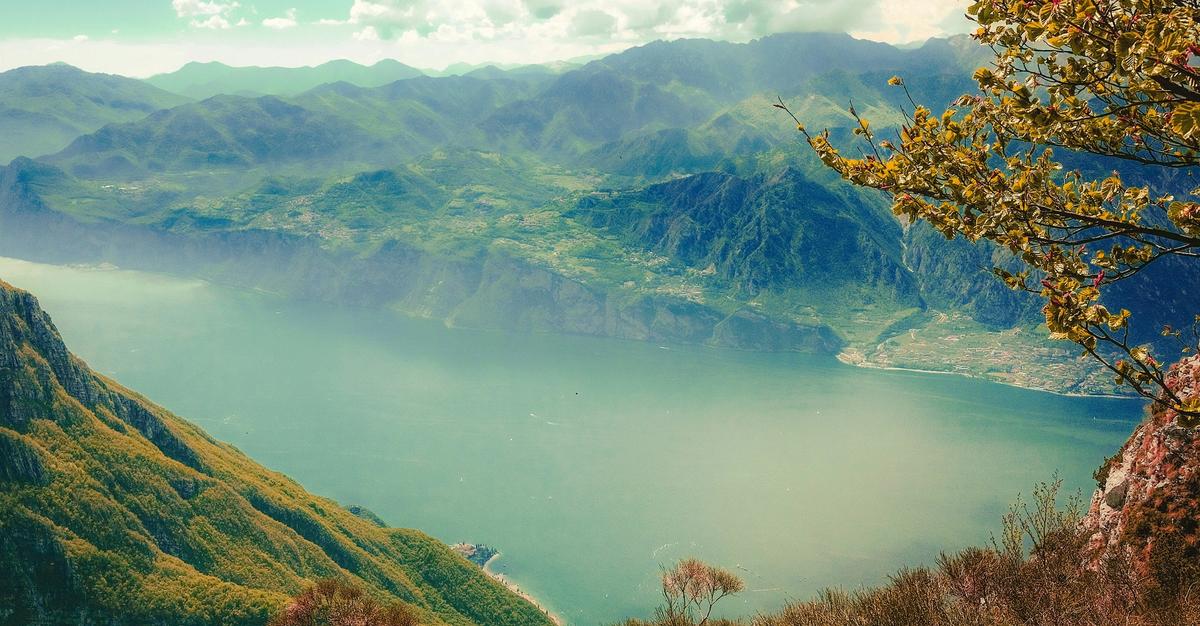 Mountain side video looks down into a lake.
