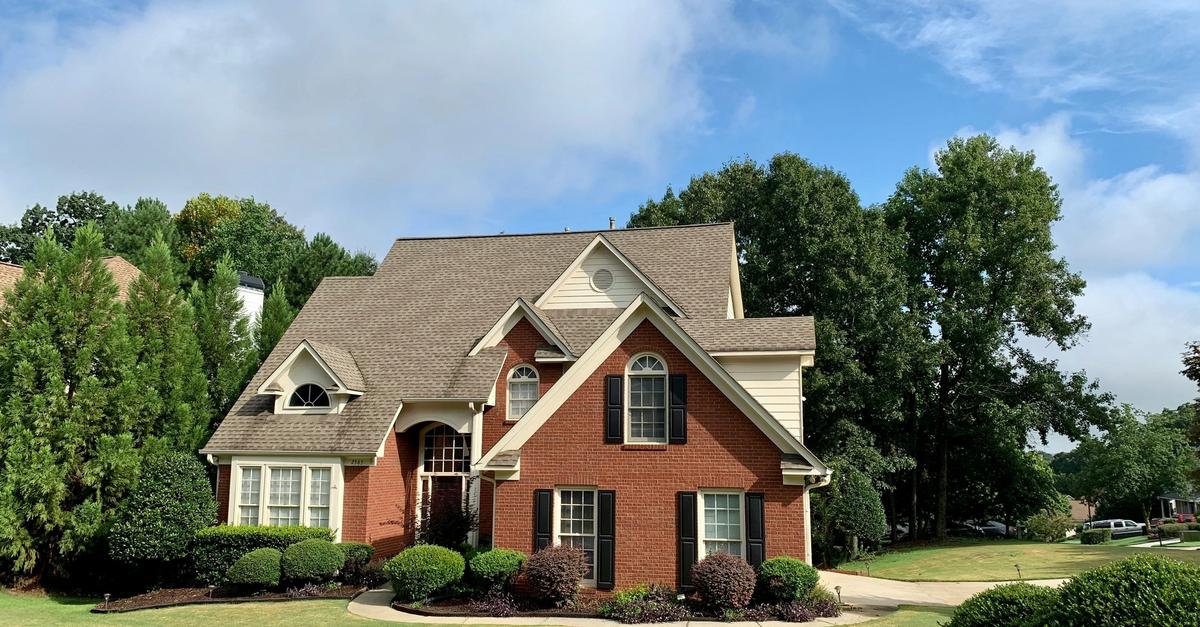 Red brick house with on property by Johnson.