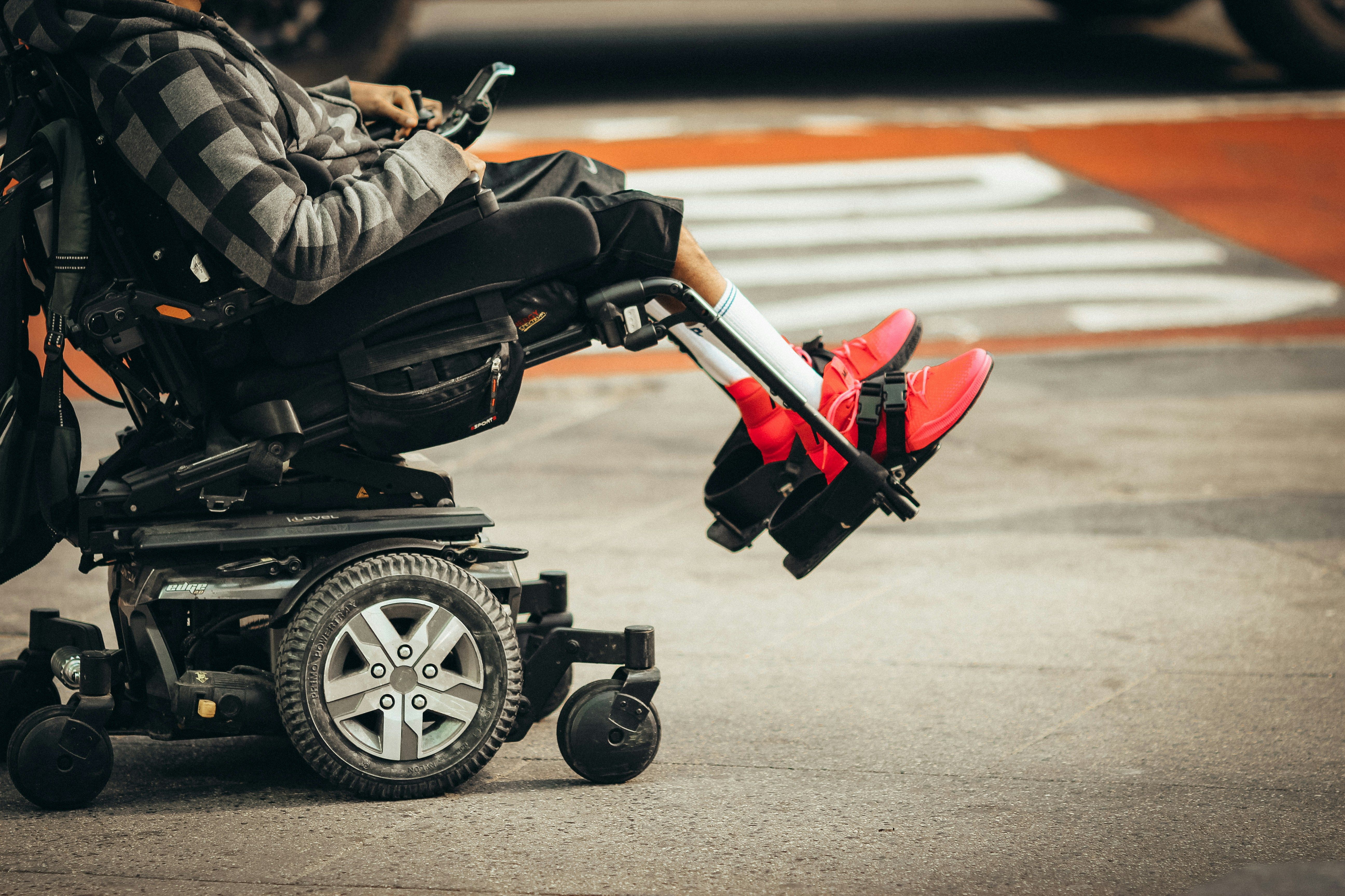 Special needs person in wheelchair by Jon Tyson.
